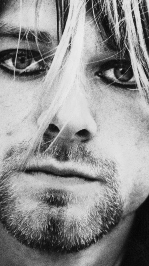 Kurt Cobain i tæt og grungeligt udseende. Wallpaper