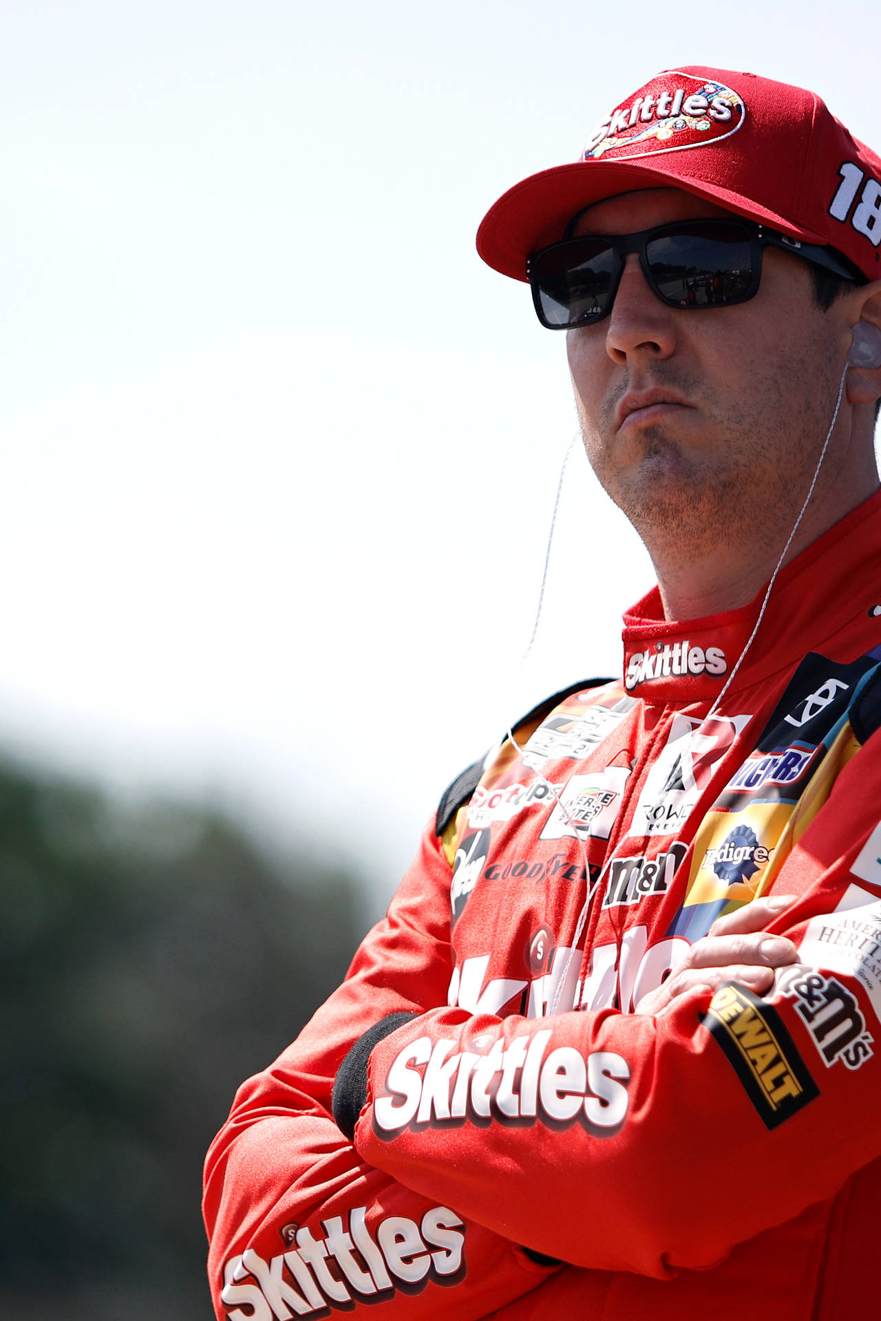 Kyle Busch In Red Suit And Cap Wallpaper