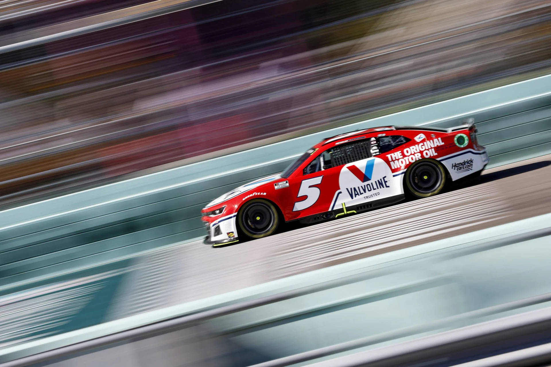 Kyle Larson Speeding In Red Car Wallpaper