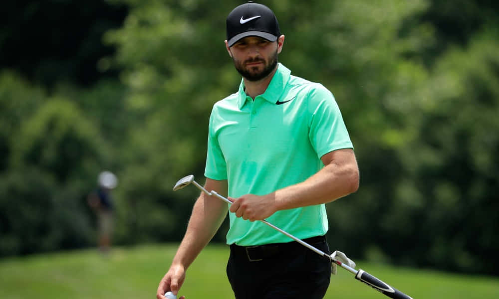 Kyle Stanley Holding Golf Club And Ball Wallpaper