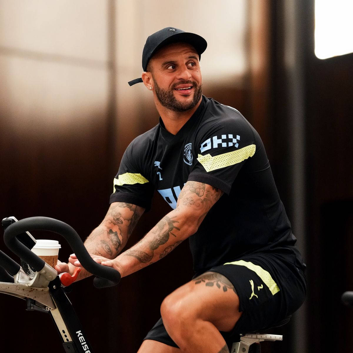 Kyle Walker Riding Stationary Bicyle Wallpaper