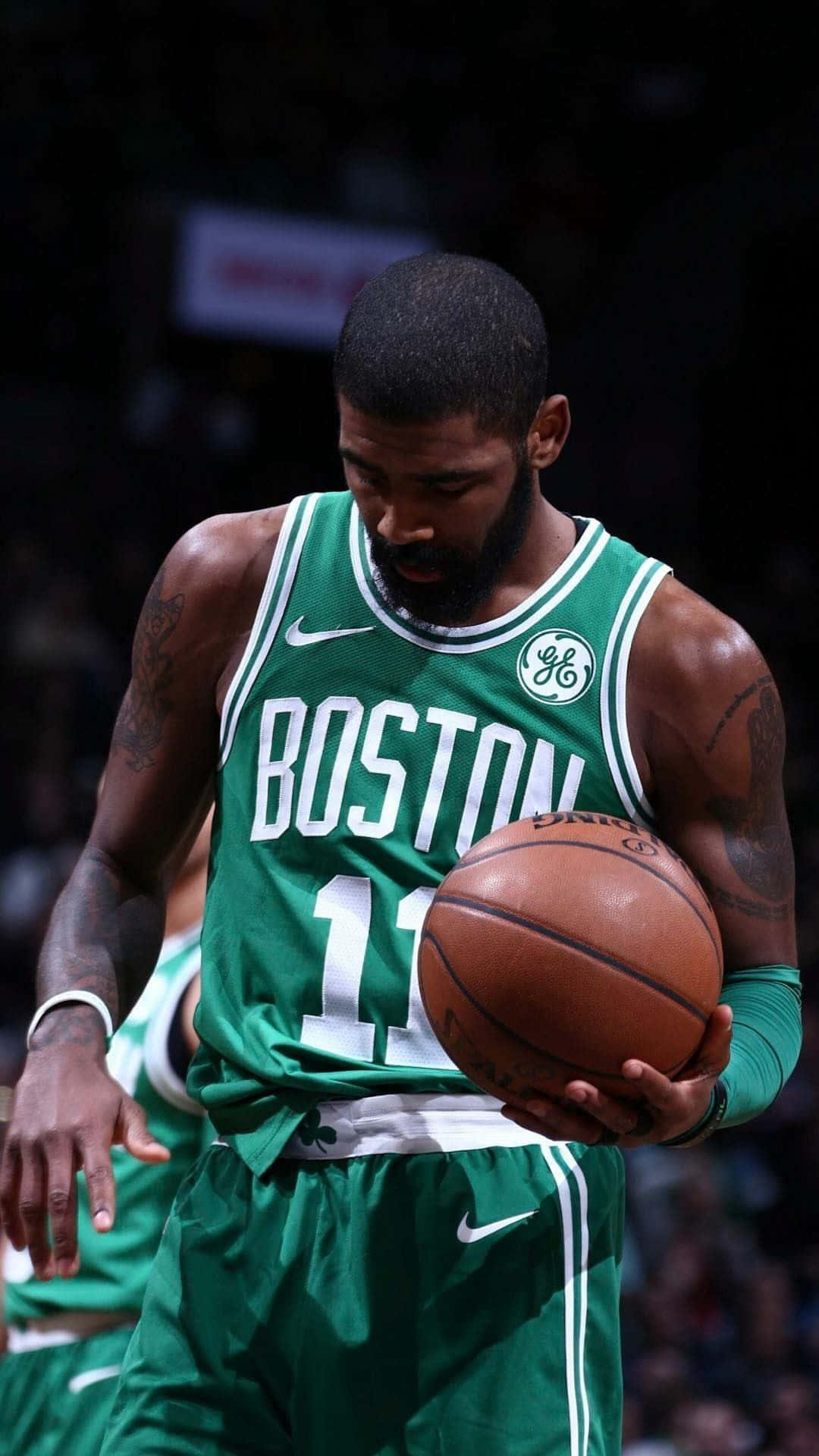 Boston Celtics Player Holding A Basketball Ball Wallpaper