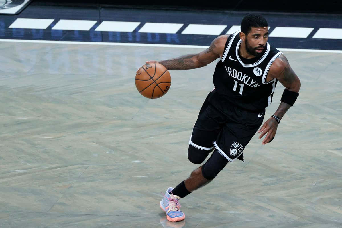 Kyrie Irving Shines Brightly in Debut Performance with Brooklyn Nets Wallpaper