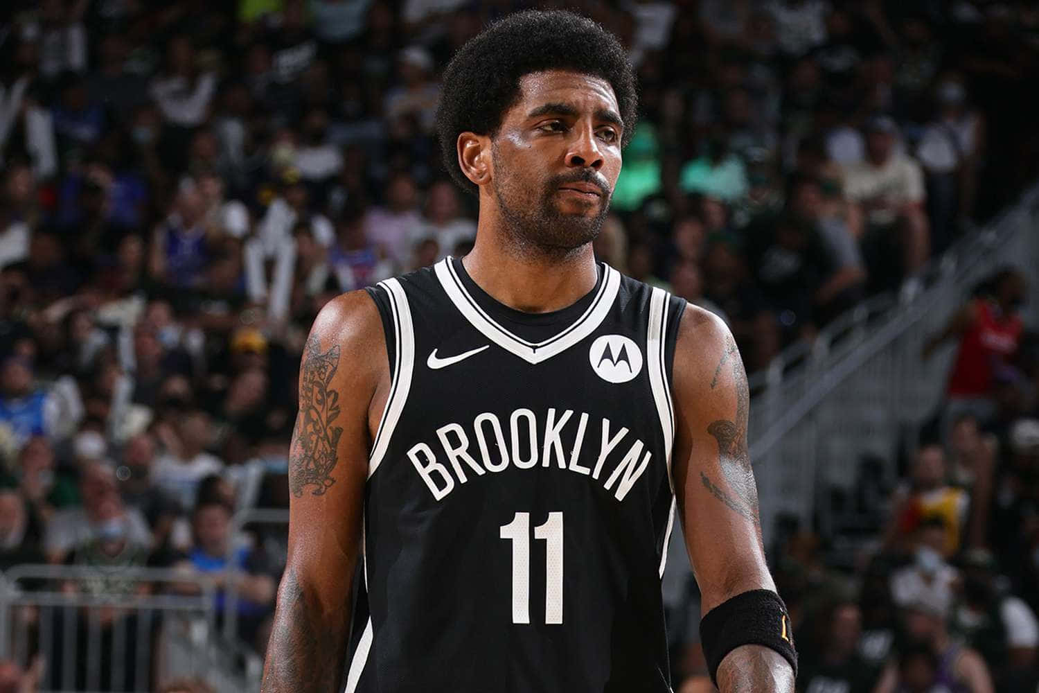 Kyrie Irving Hustles Down The Court in Brooklyn Nets Jersey Wallpaper