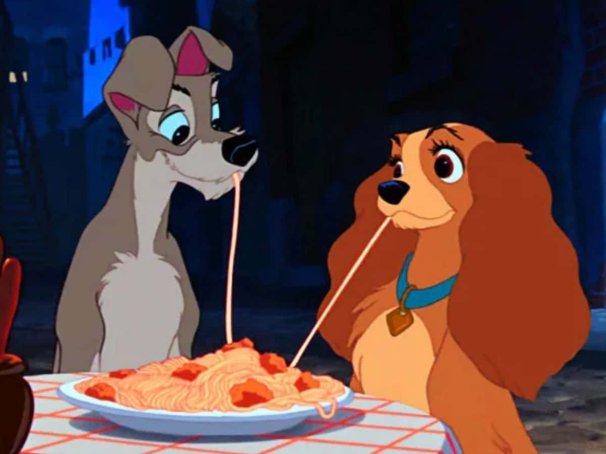 A romantic moment between Lady and the Tramp under the moonlit sky Wallpaper