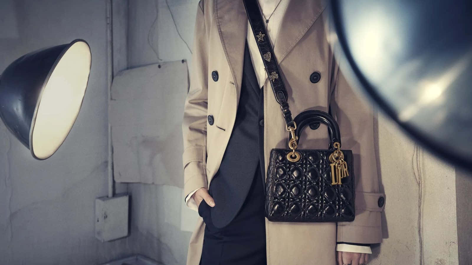Caption: Elegant Lady Dior Handbag Wallpaper