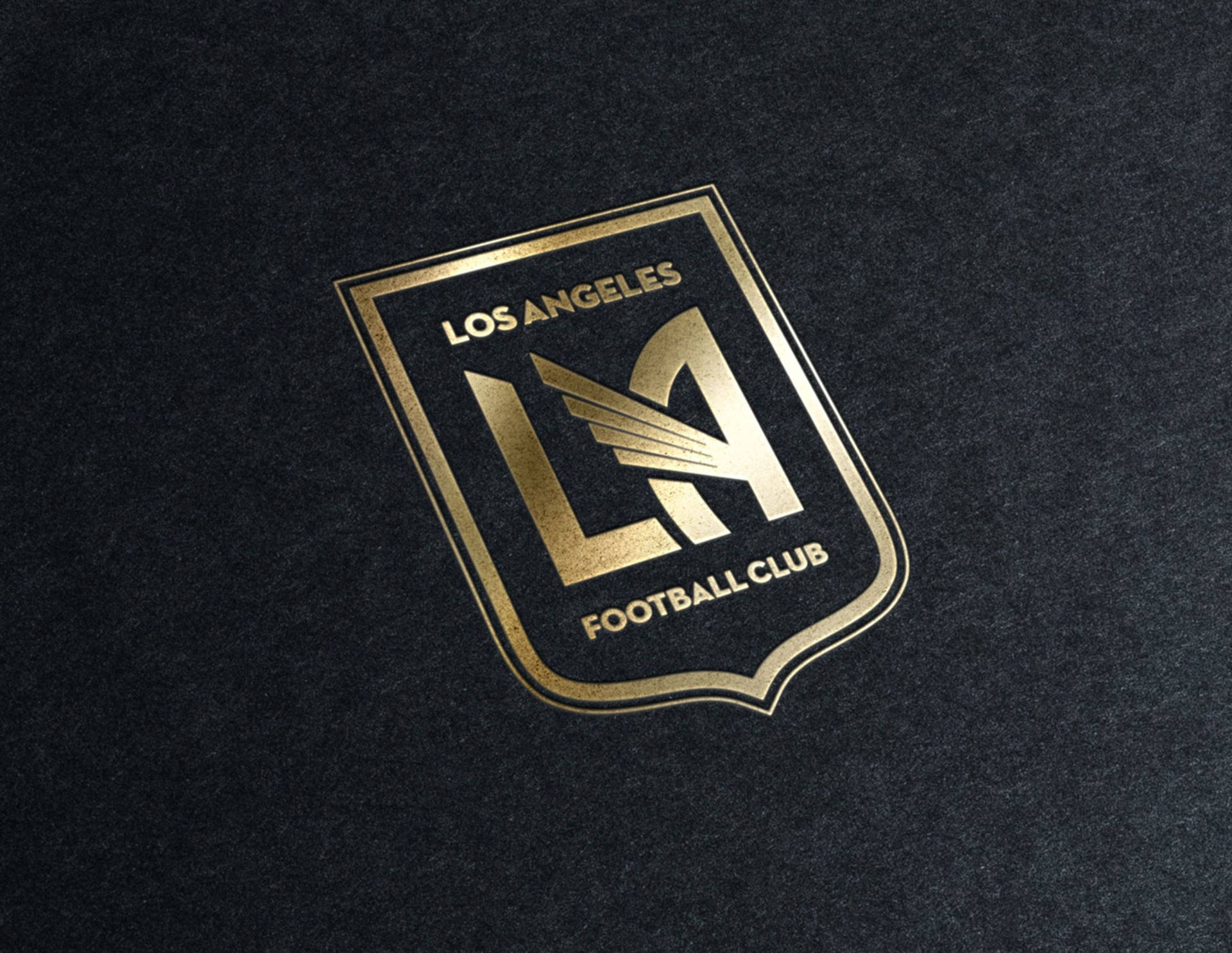 LAFC Gold Logo Embedded On Black Backdrop Wallpaper