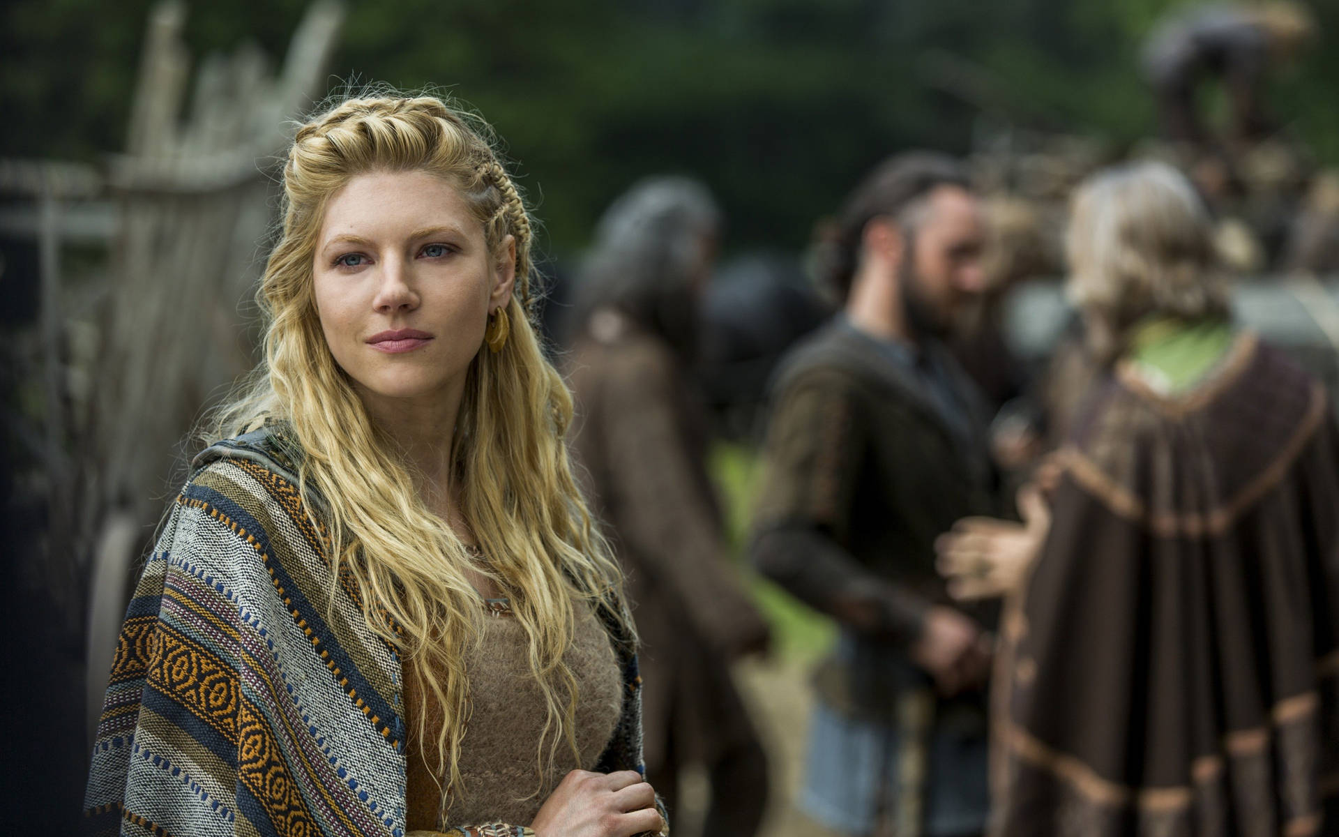 Lagertha With Other Vikings Behind Wallpaper