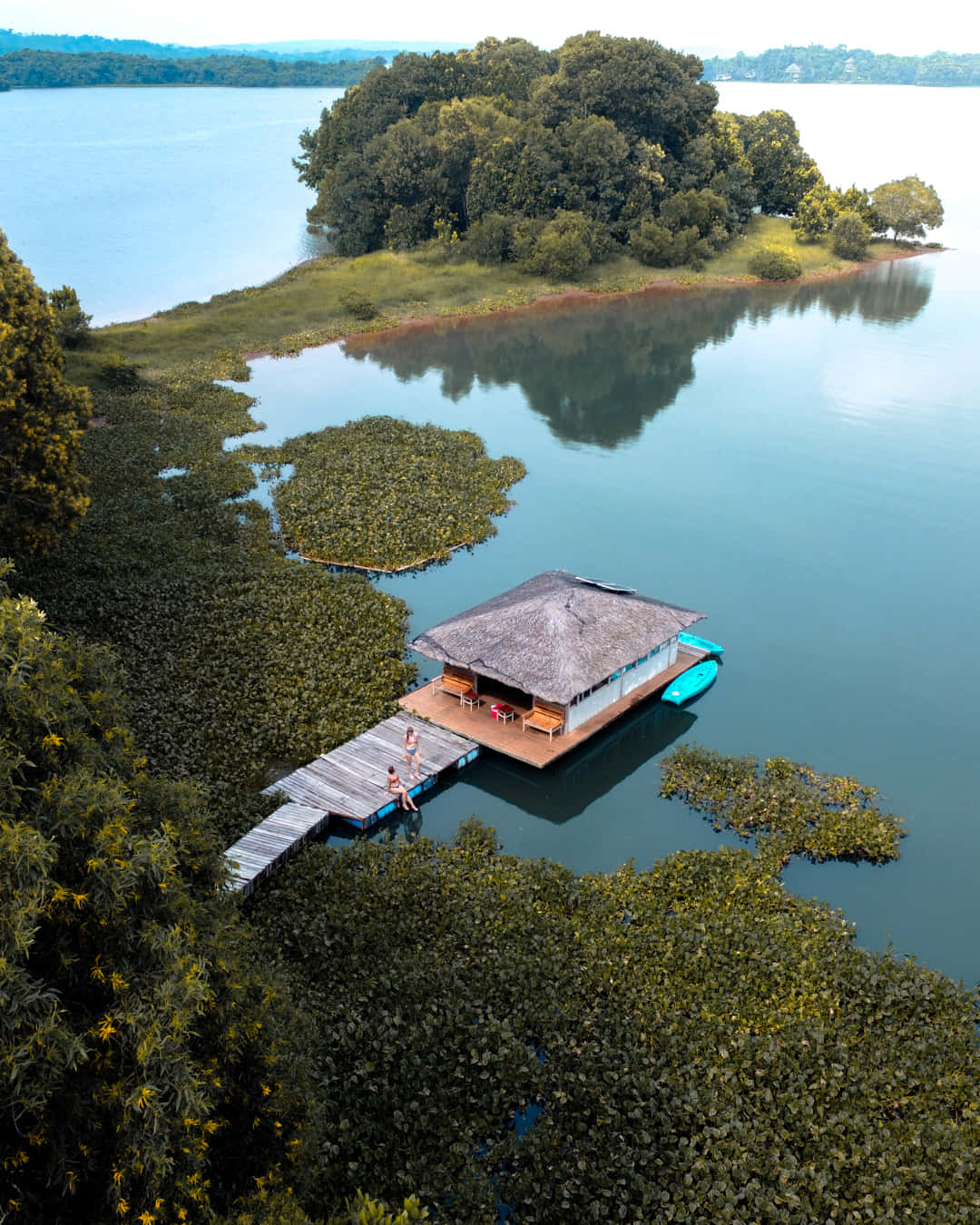 A House On A Dock In The Middle Of A Lake