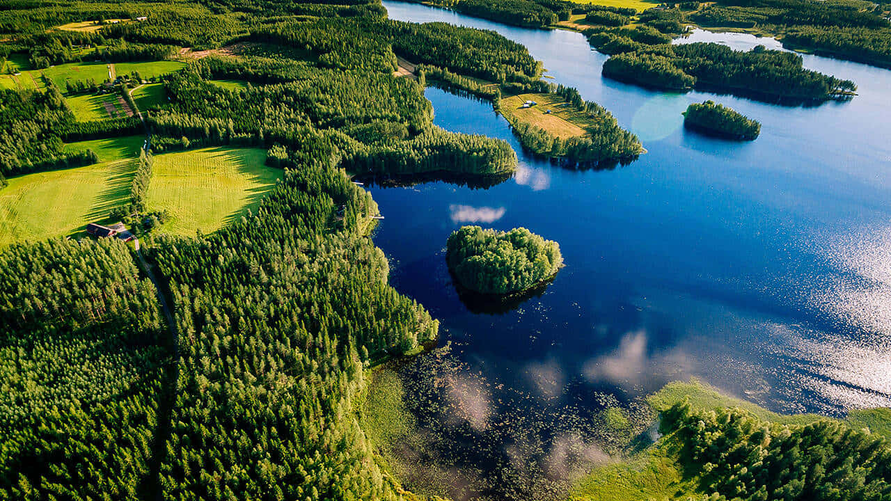 Lakeside Aerial View Forested Archipelago Wallpaper