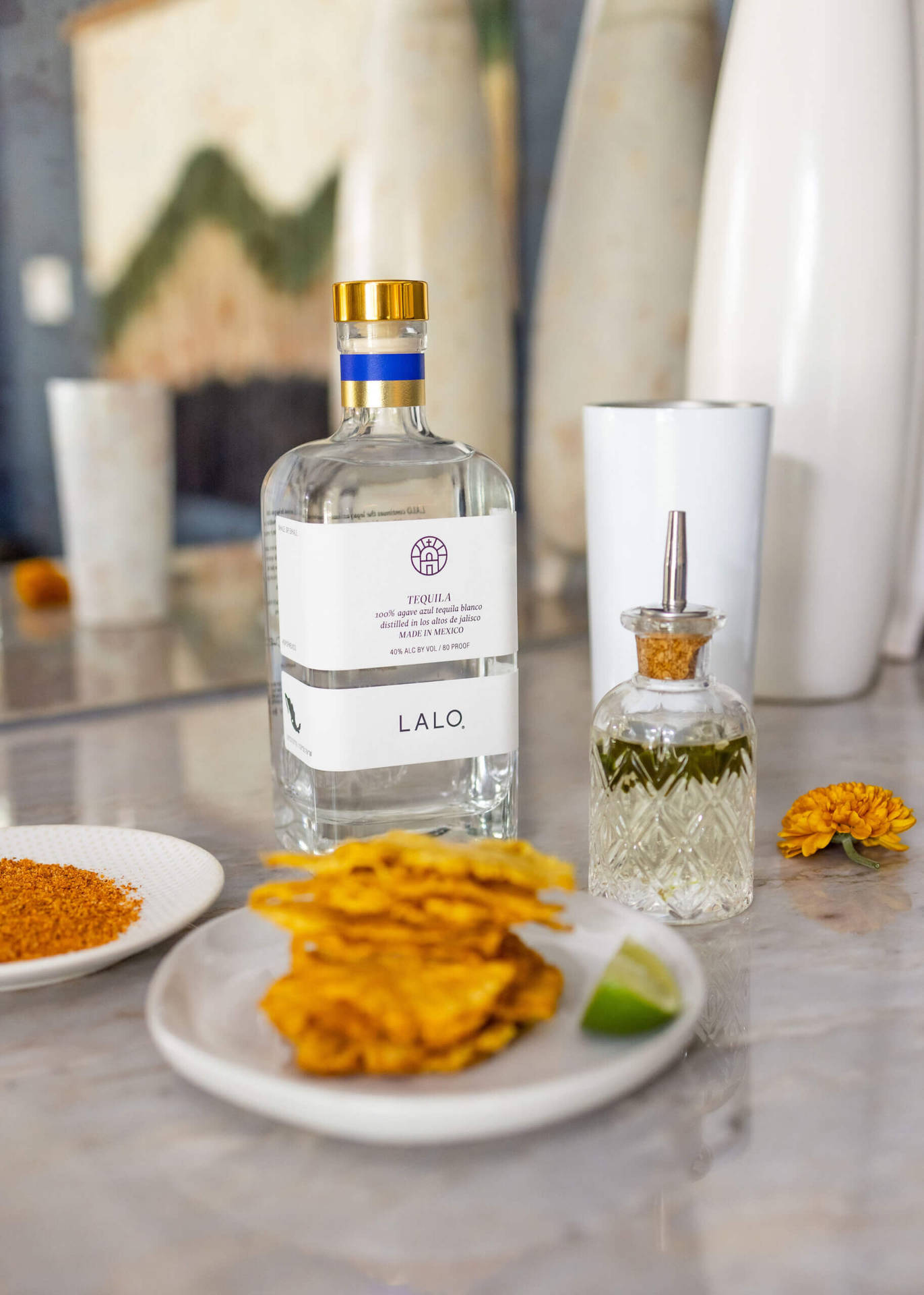 Savor the Essence of Lalo Tequila Paired with Crispy Snacks Wallpaper