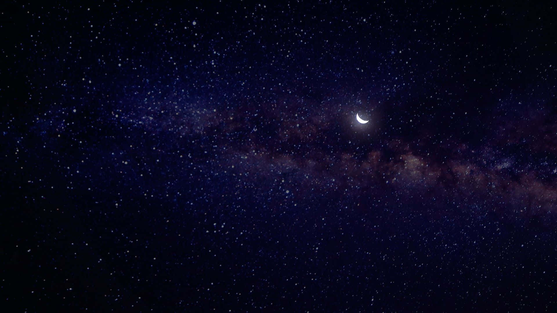 Laluna Luminosa E Le Stelle Che Brillano In Un Cielo Notturno.