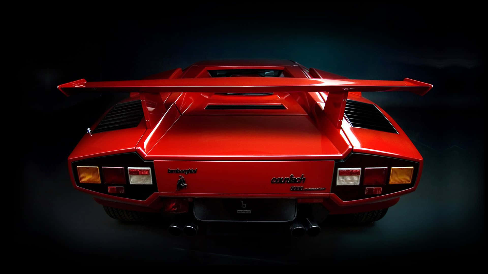 Sleek, Red Lamborghini Countach on the Road Wallpaper