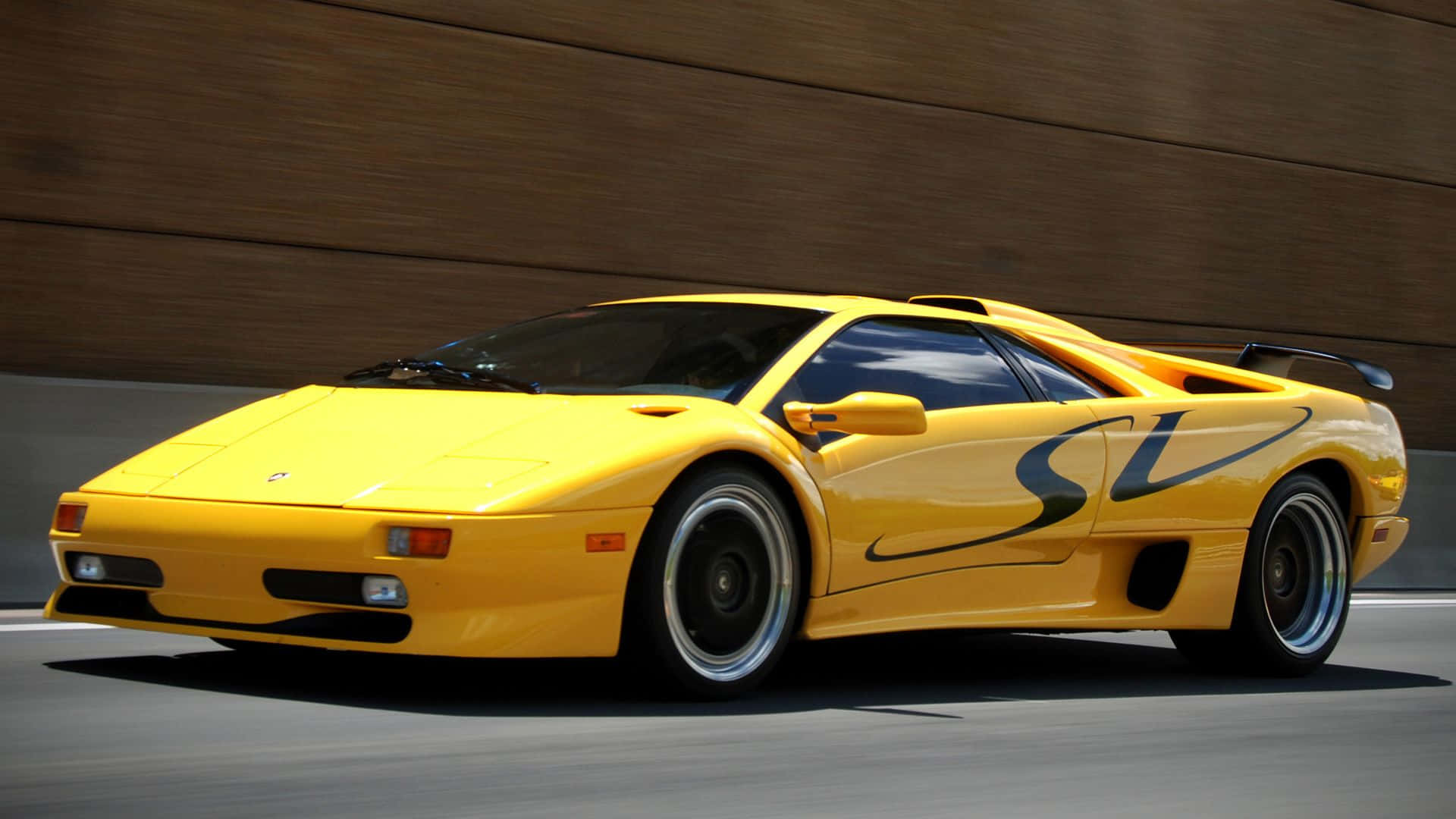 Majestic Lamborghini Diablo Roaring on the Road Wallpaper