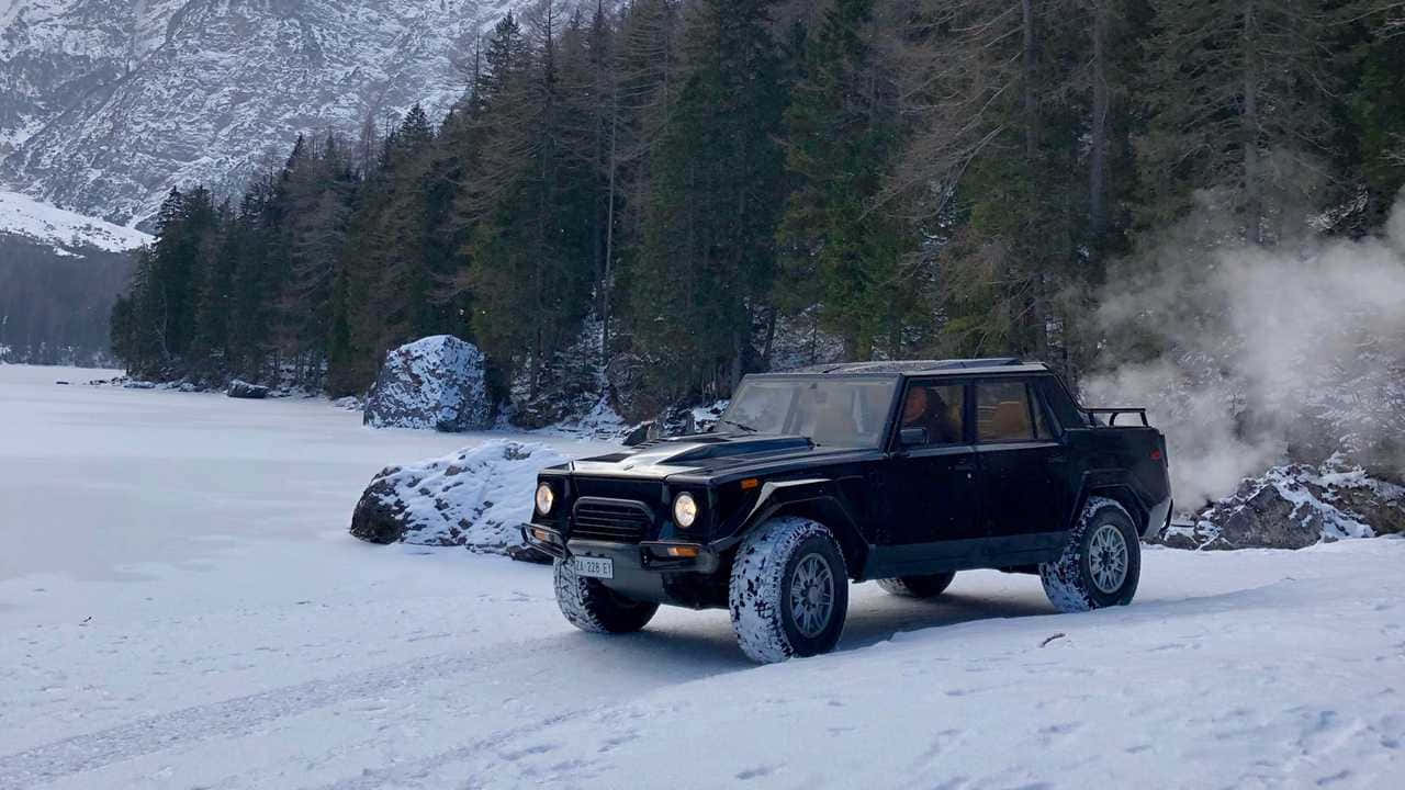 Exquisite Lamborghini LM002 on a scenic mountain road Wallpaper