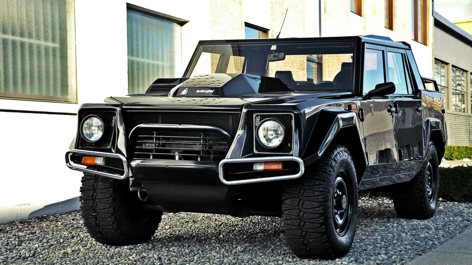 A Lamborghini LM002 showcased in a stunning landscape. Wallpaper