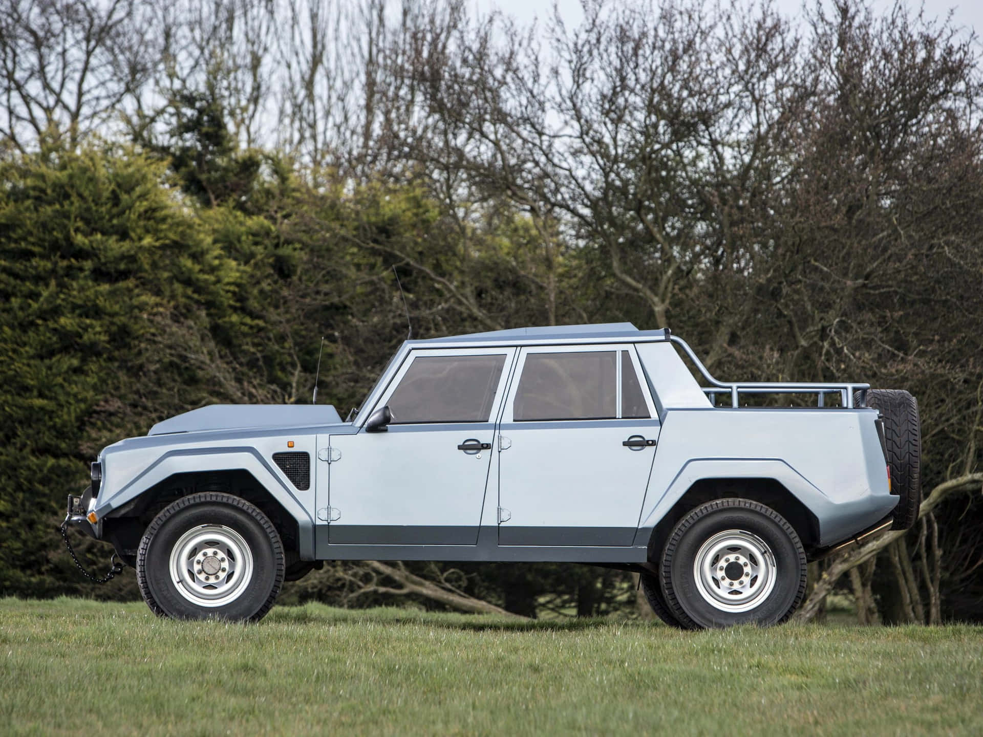 A Lamborghini LM002, the iconic luxury off-road vehicle, in high resolution wallpaper. Wallpaper