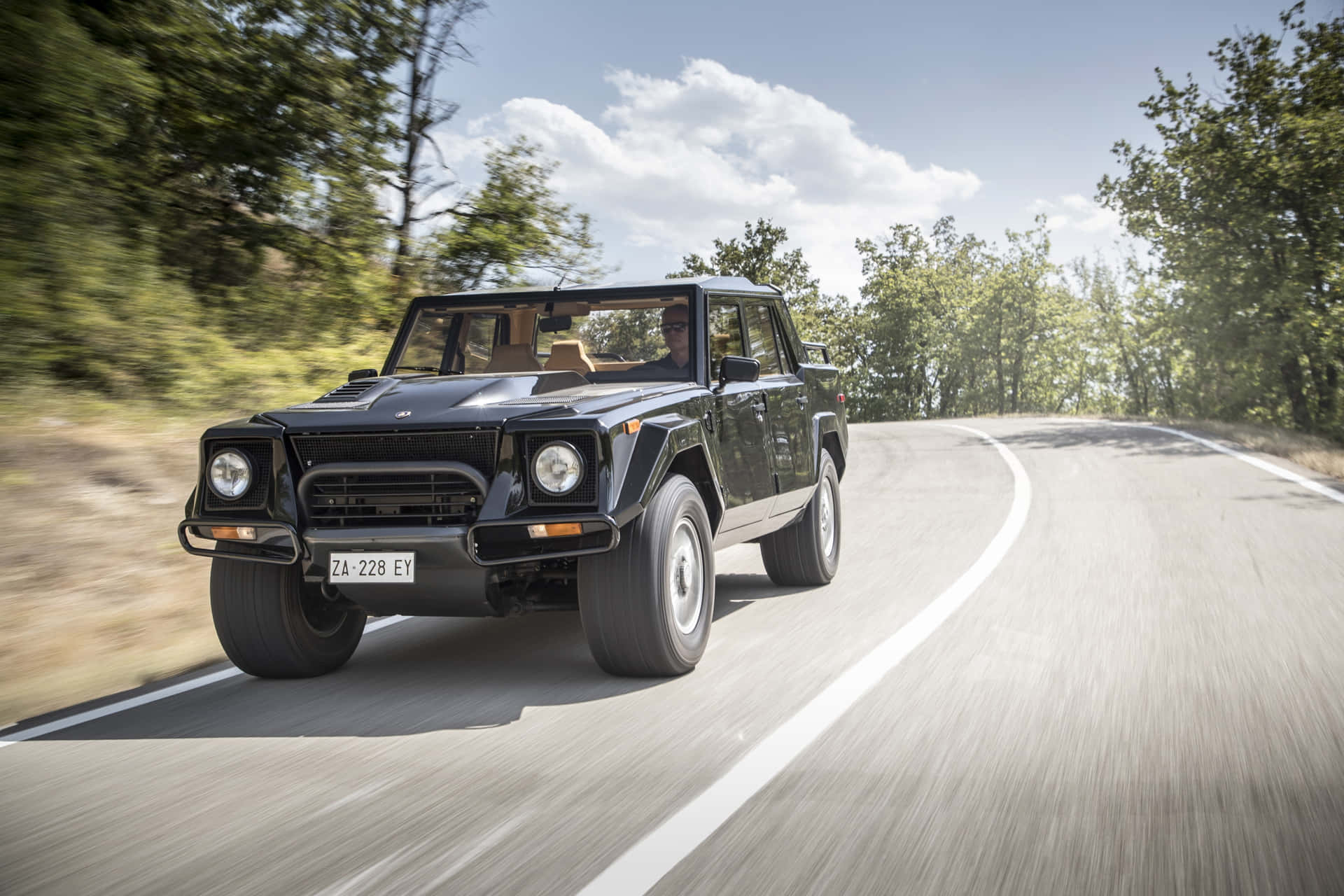 The Iconic Lamborghini LM002 showcasing its timeless design and powerful presence Wallpaper
