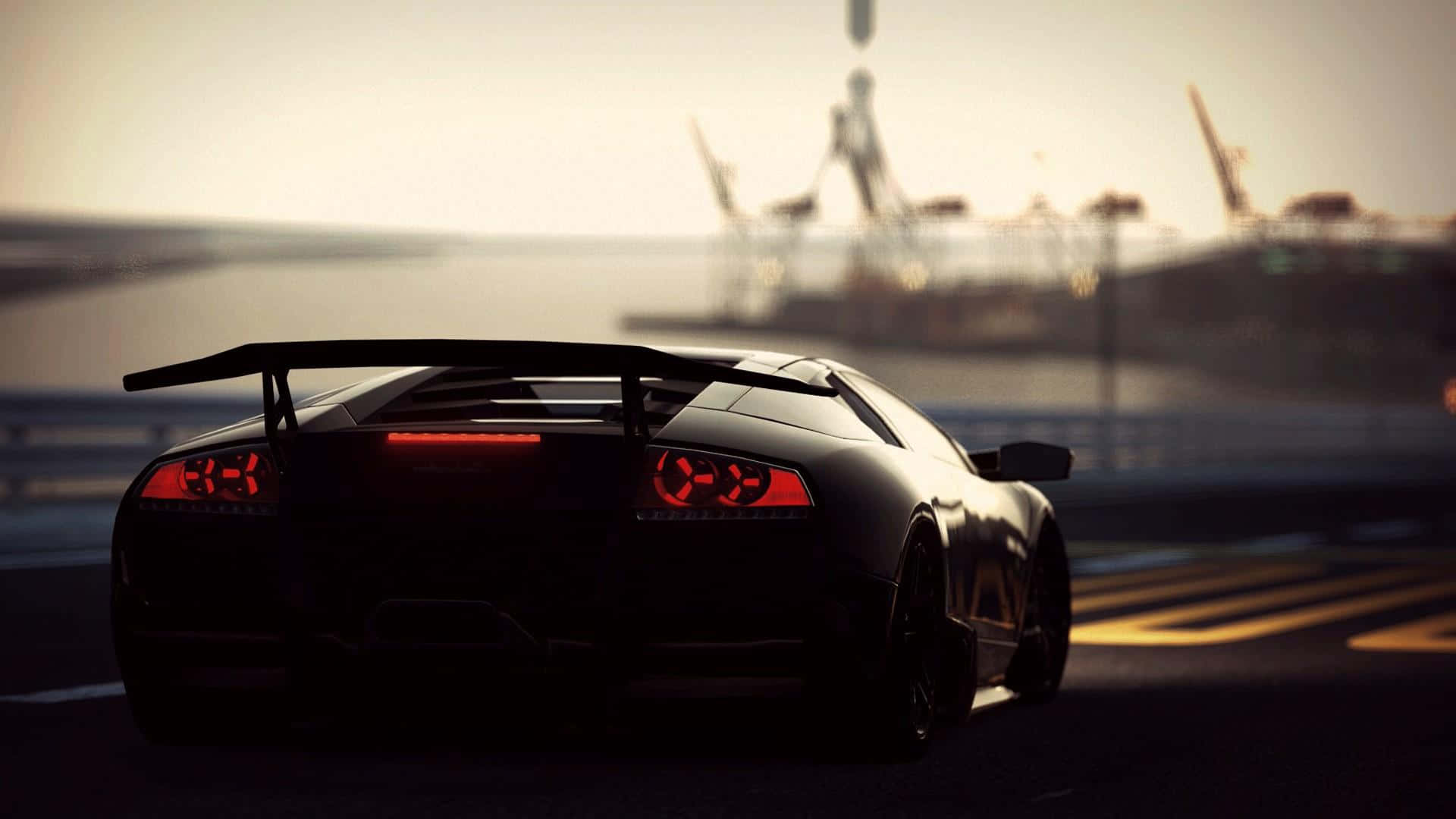 Sleek Black Lamborghini Murcielago Unleashing Power on a Desert Highway Wallpaper