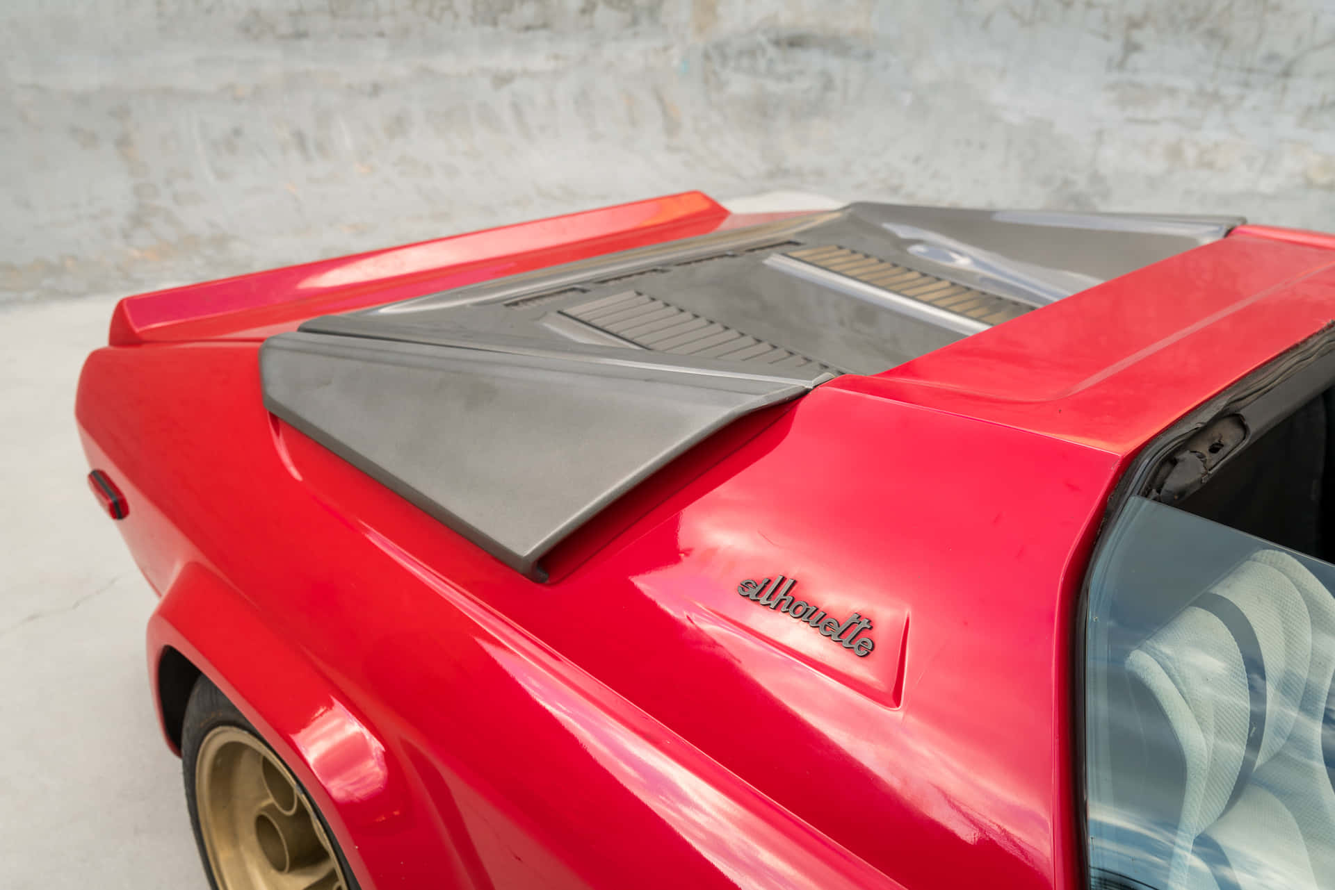 Sleek Lamborghini Silhouette gliding on an open road Wallpaper