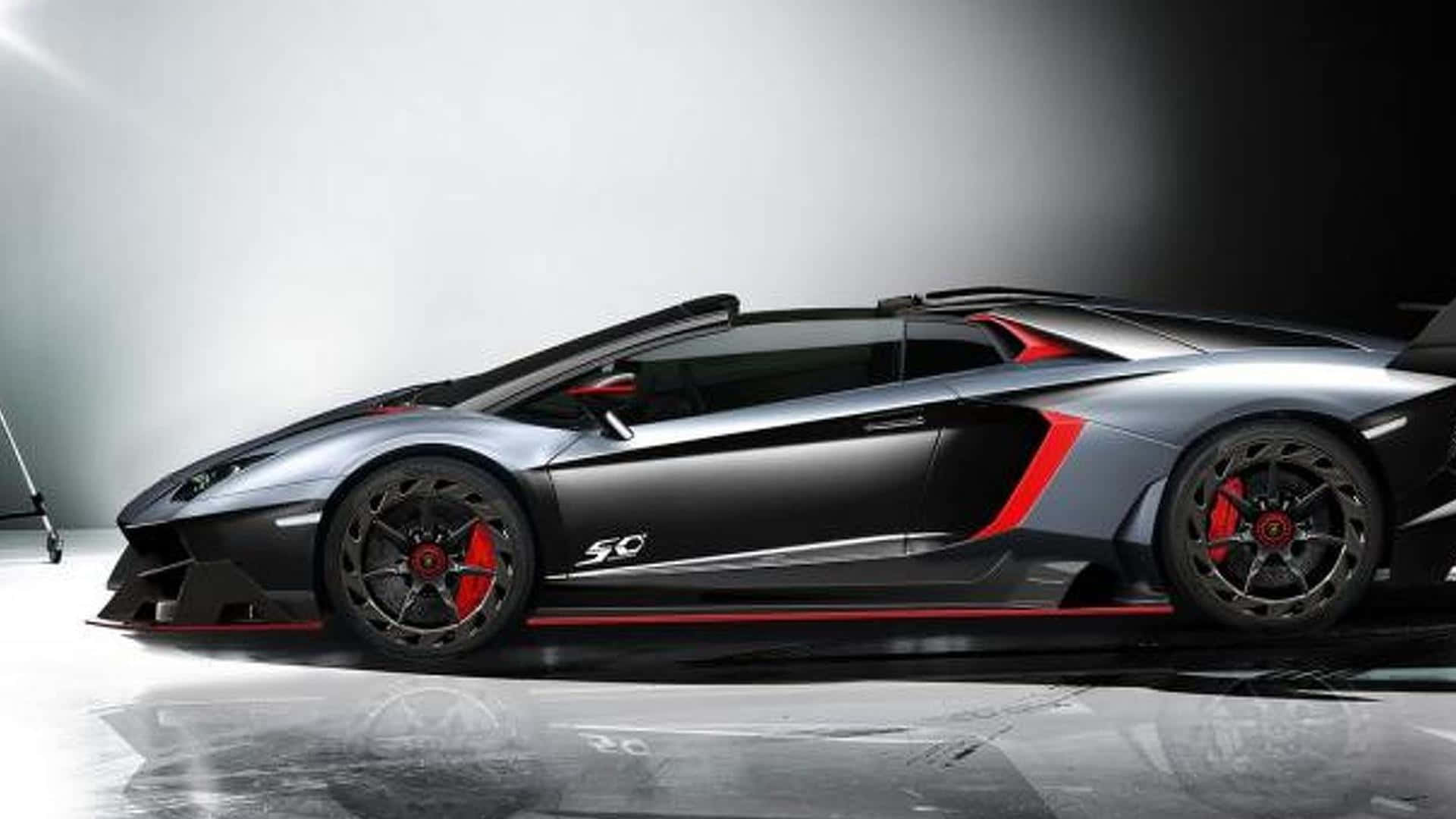 Unimpresionante Lamborghini Veneno Mostrando Su Elegante Diseño Y Su Impecable Ingeniería En Contra De Un Fondo Vibrante. Fondo de pantalla