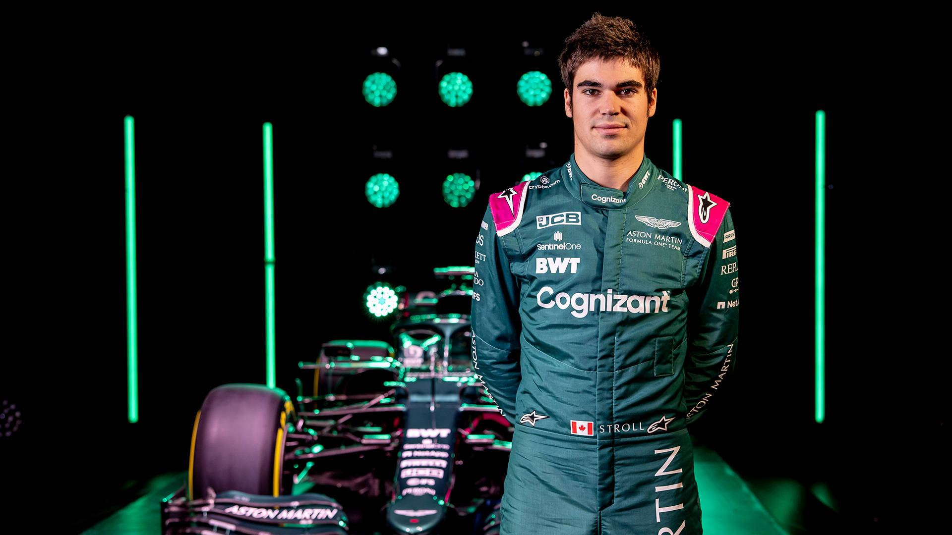 F1 Star Lance Stroll Posing with His Racing Car Wallpaper