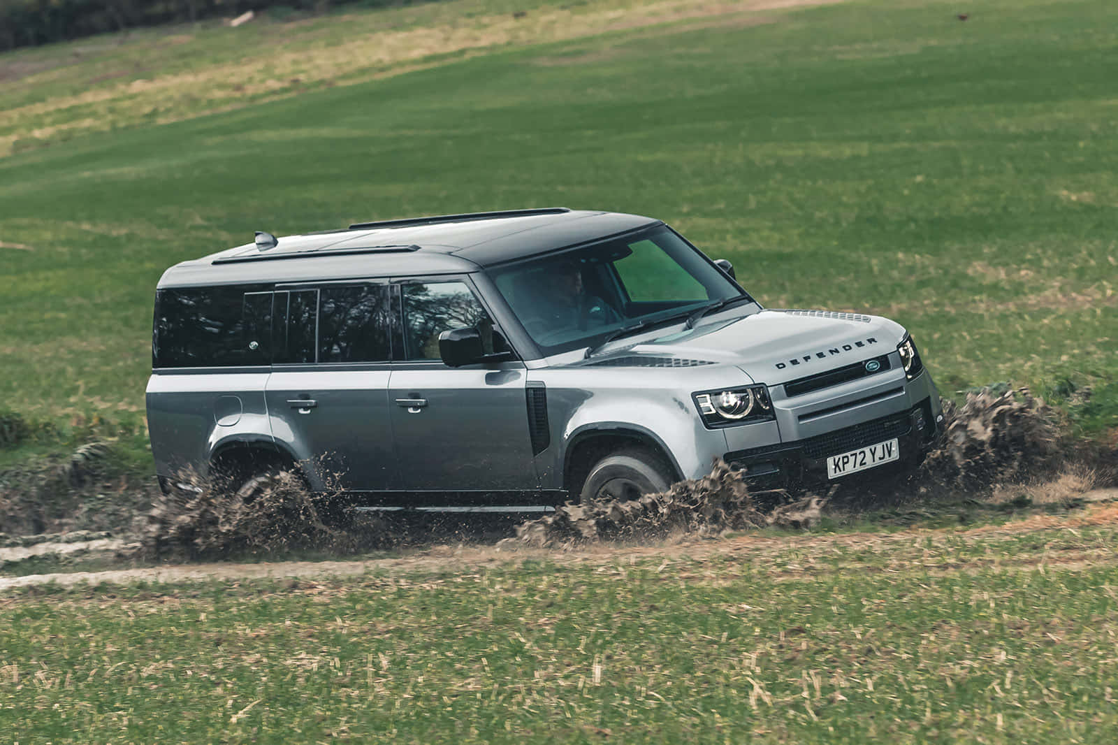 Land Rover Defender conquering rugged terrain Wallpaper