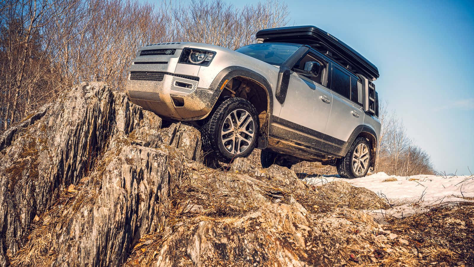 Land Rover Defender conquering off-road terrain Wallpaper
