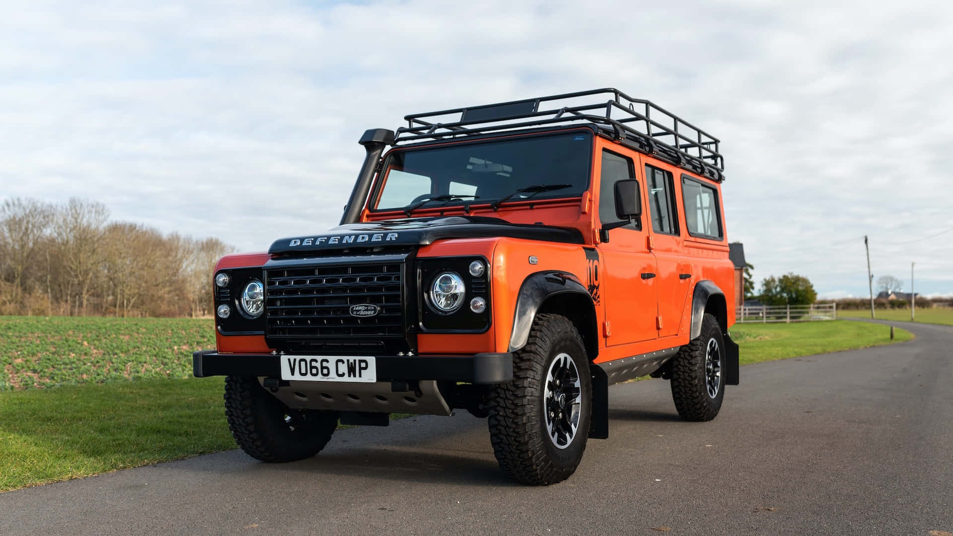 A Rugged Land Rover Defender Dominating the Off-Road Terrain Wallpaper