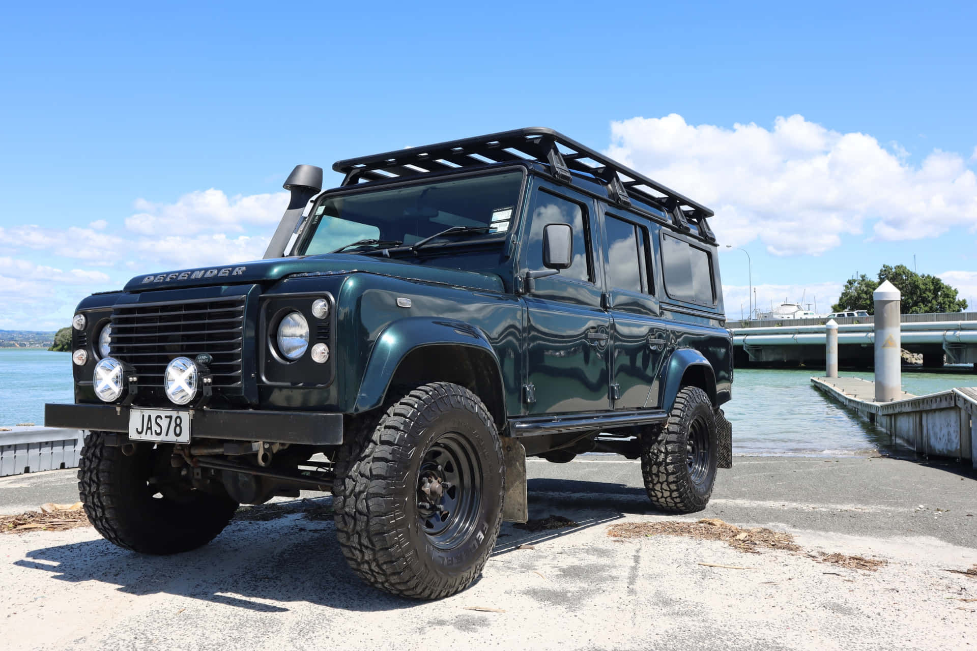 Land Rover Defender 4x4 conquering rugged terrain Wallpaper