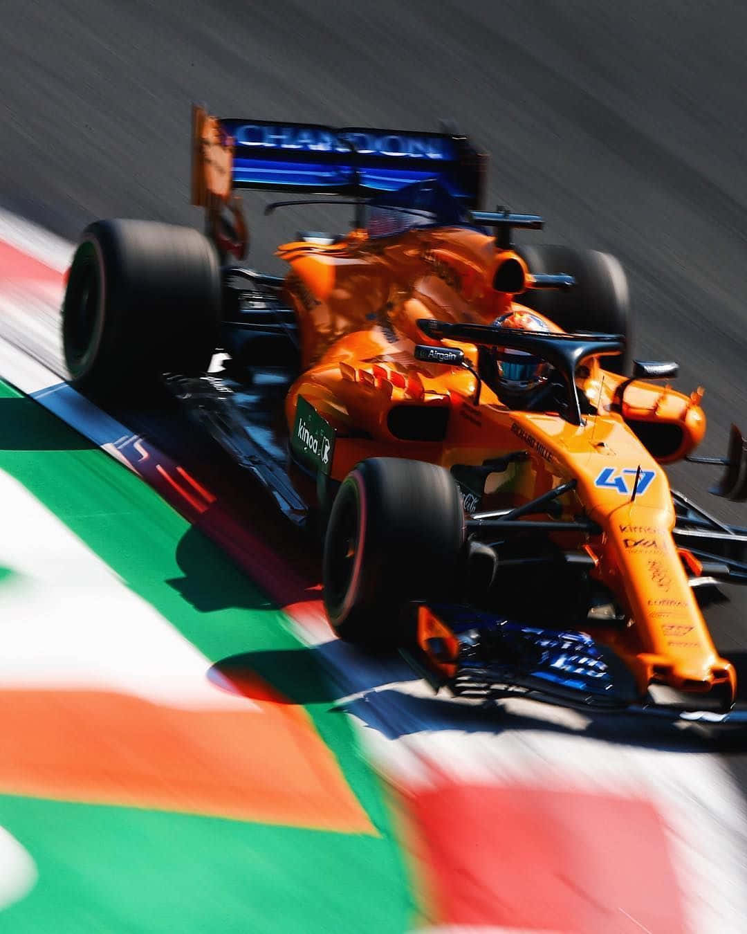 F1 driver Lando Norris looking focused and determined on the track