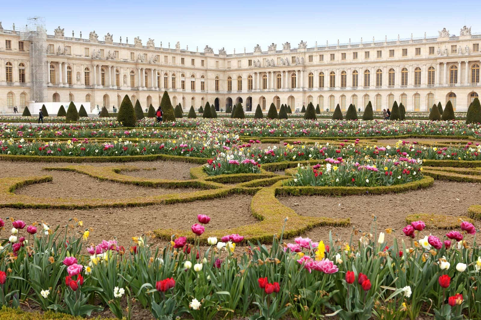 A Large Garden With A Large Palace In The Background