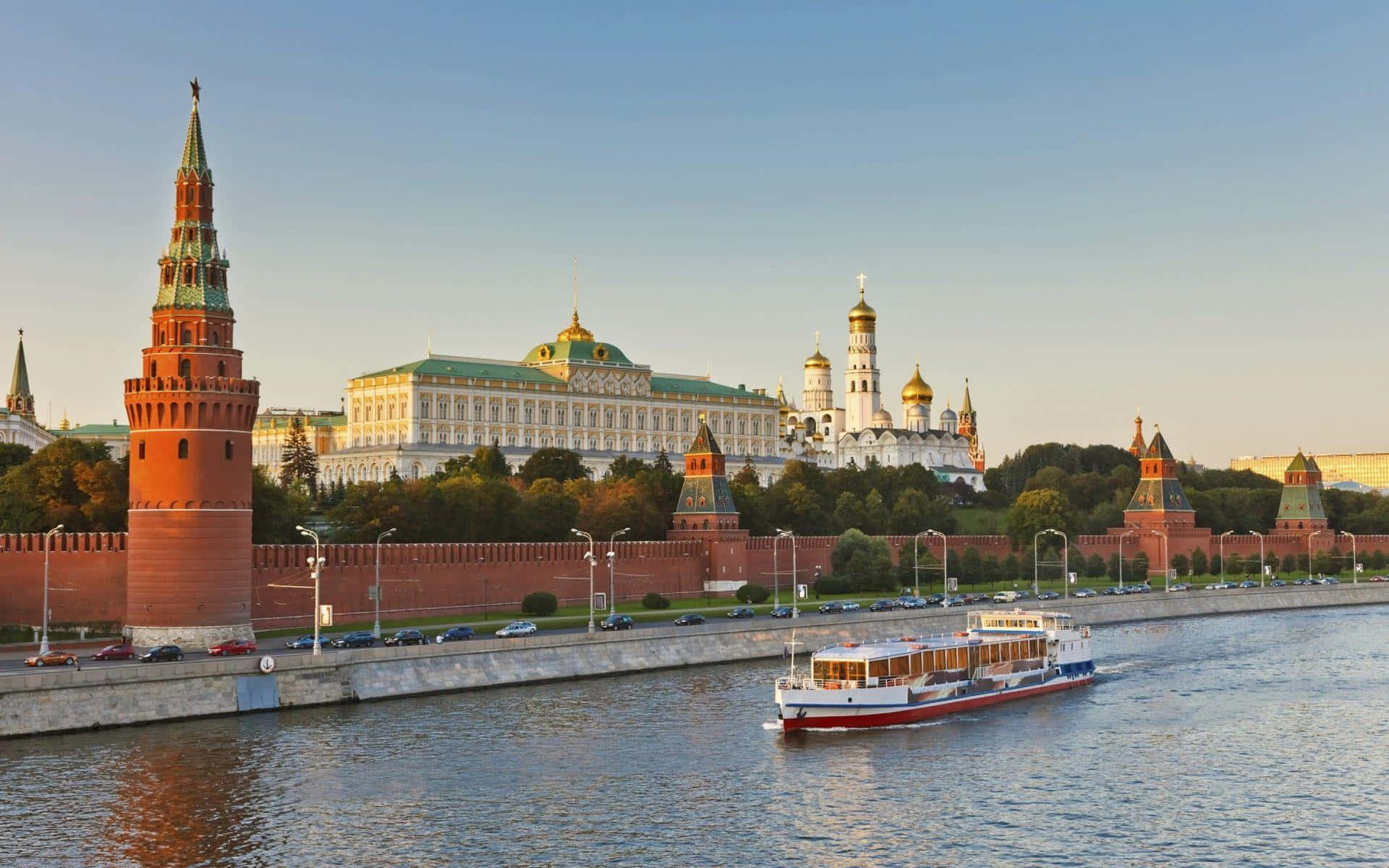 Majestic view of the Kremlin Palace amidst a serene landscape Wallpaper