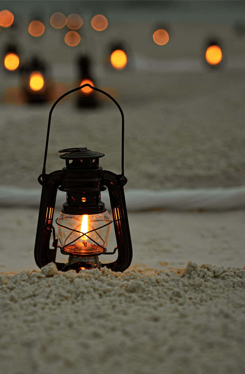Illuminated lantern against a dark background