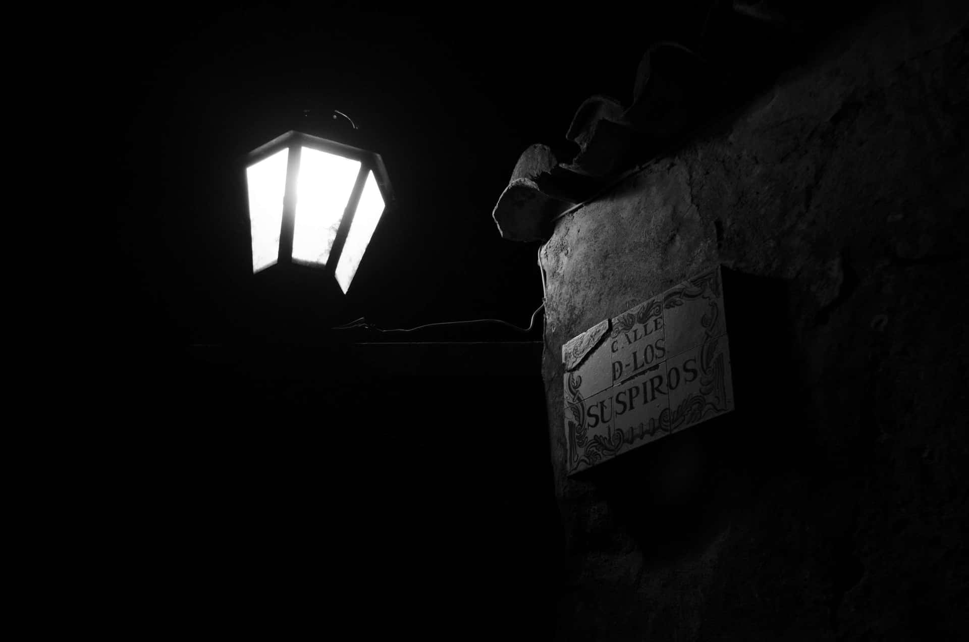 Lantern Illuminated Sighs Sign Wallpaper