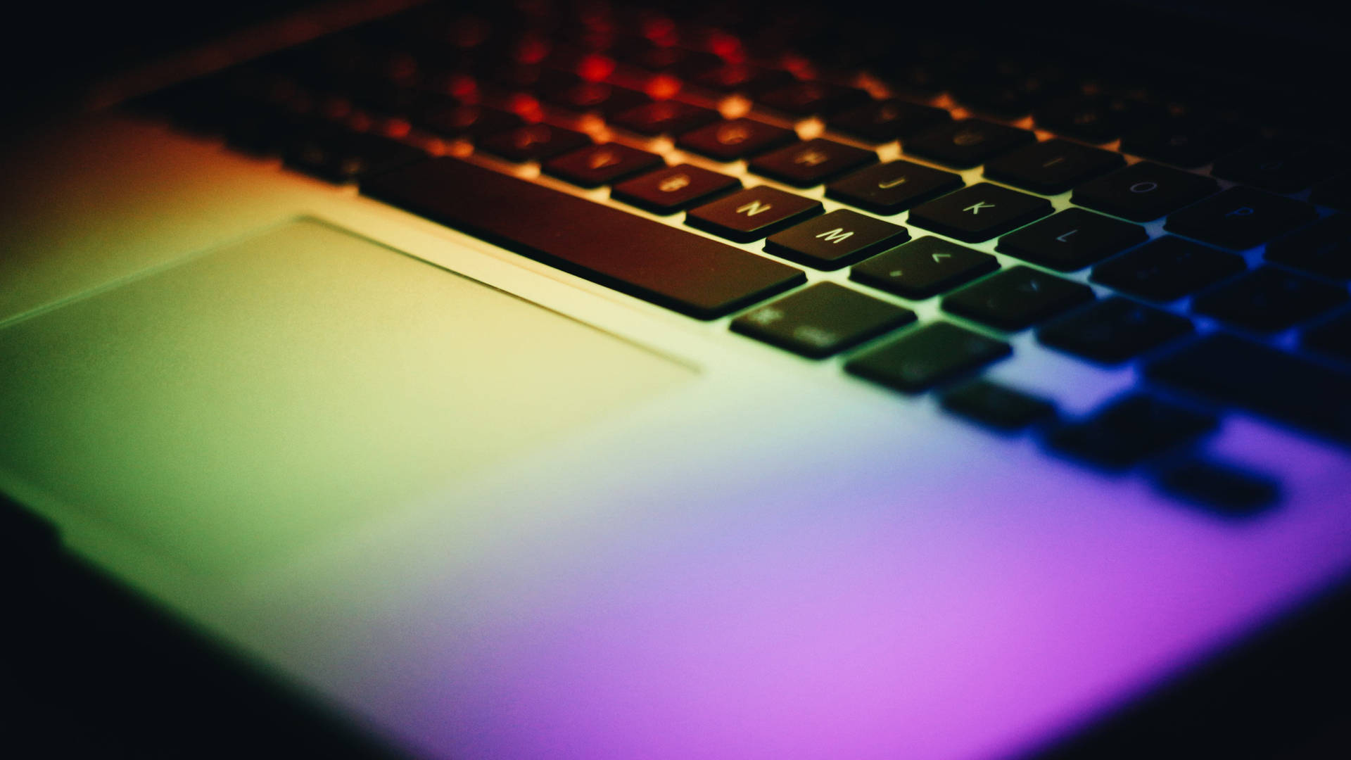 Laptop Under Spectrum Light Wallpaper