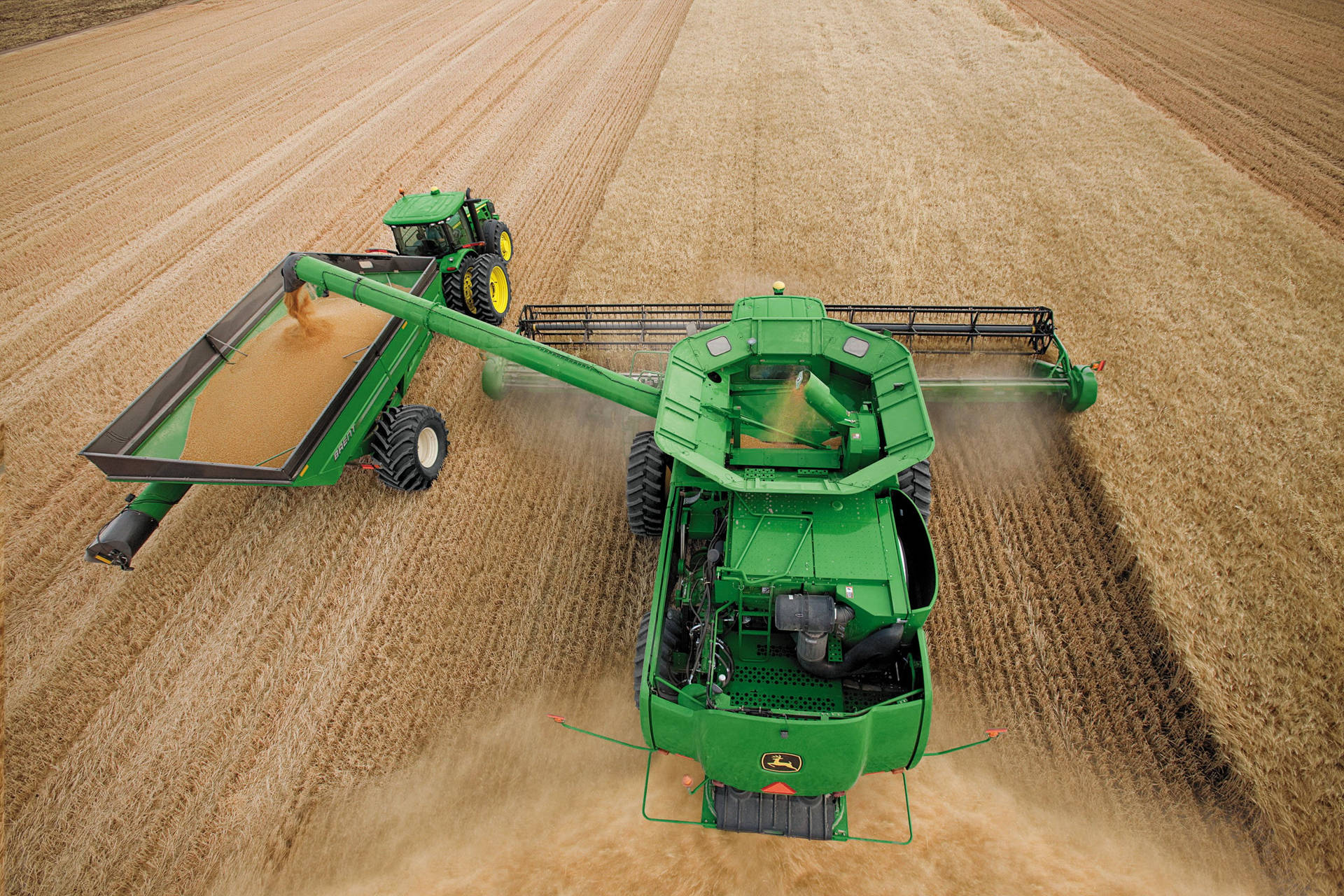 Large John Deere Machine Harvesting Wheat Wallpaper