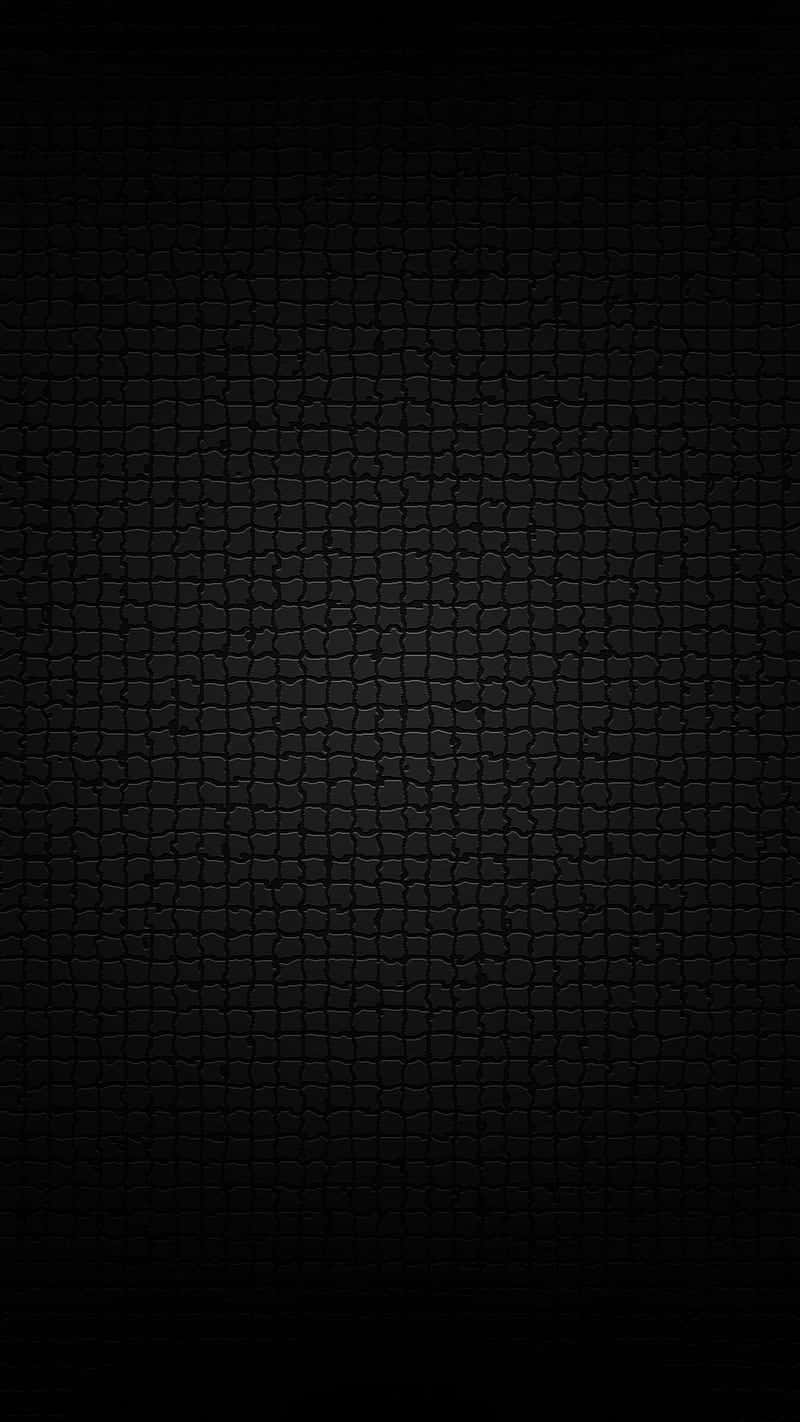 A Black Background With A Brick Pattern Wallpaper