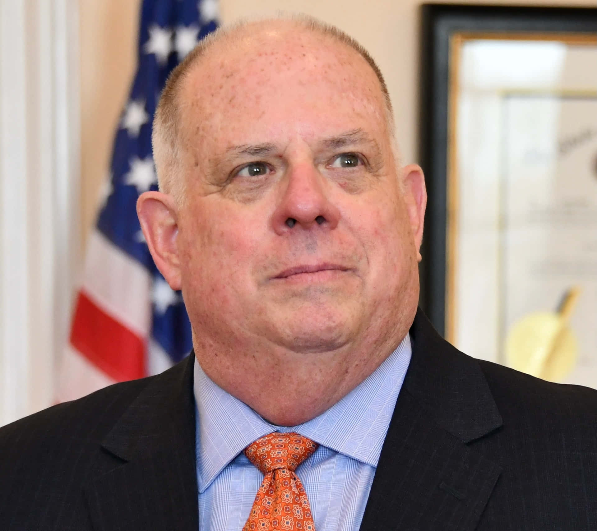 Larry Hogan Portraitwith American Flag Wallpaper