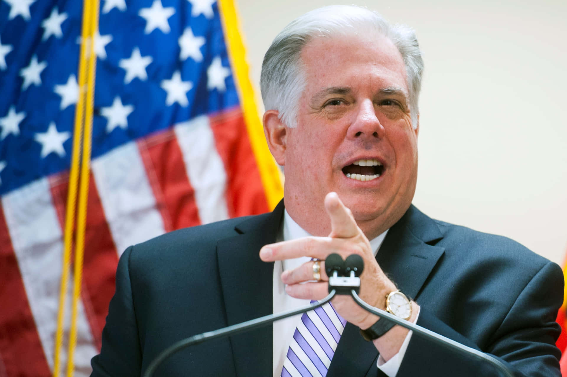 Larry Hogan Speakingwith American Flag Background Wallpaper