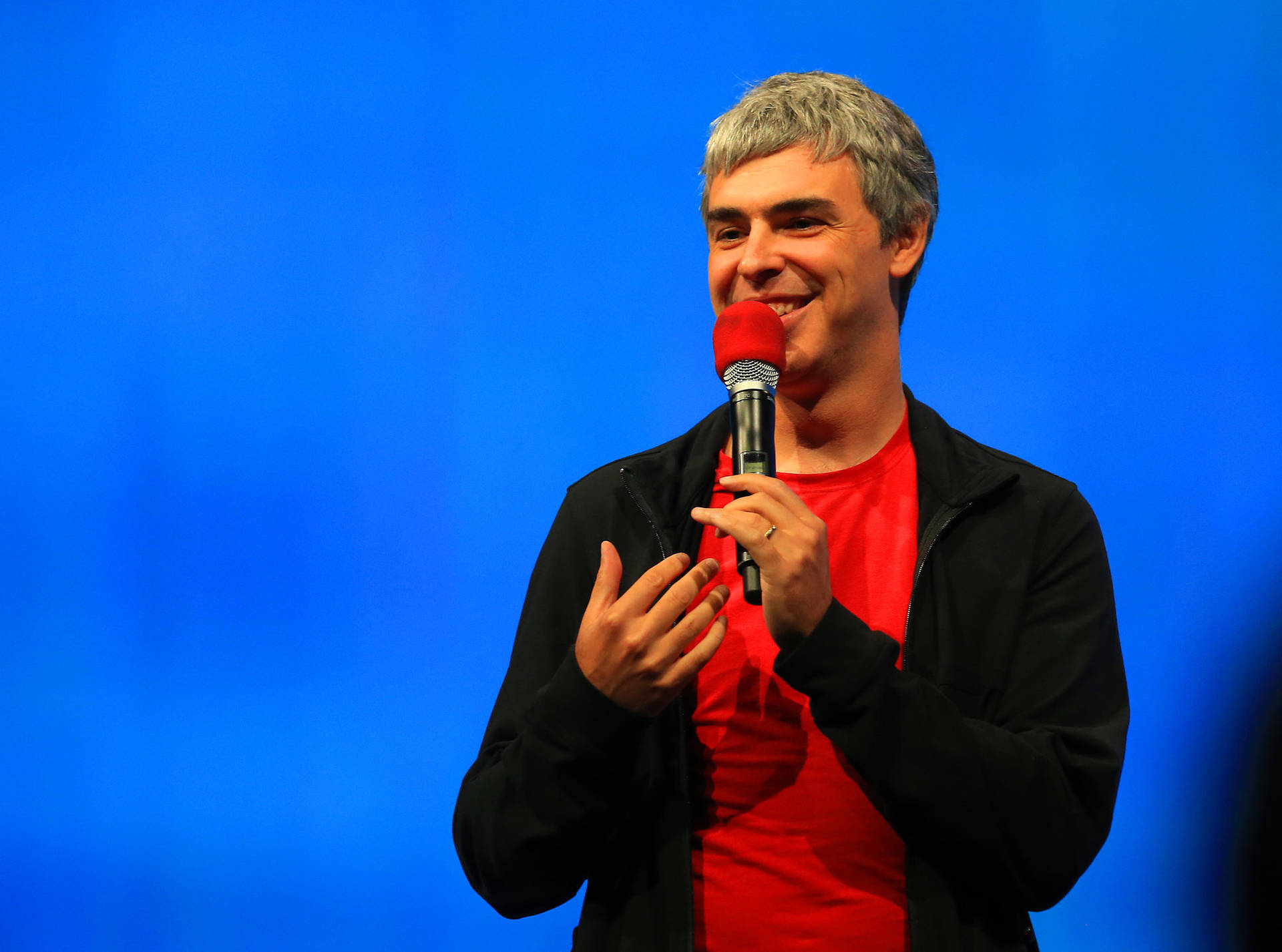 Larry Page Conference Talk Smiling Photo Wallpaper