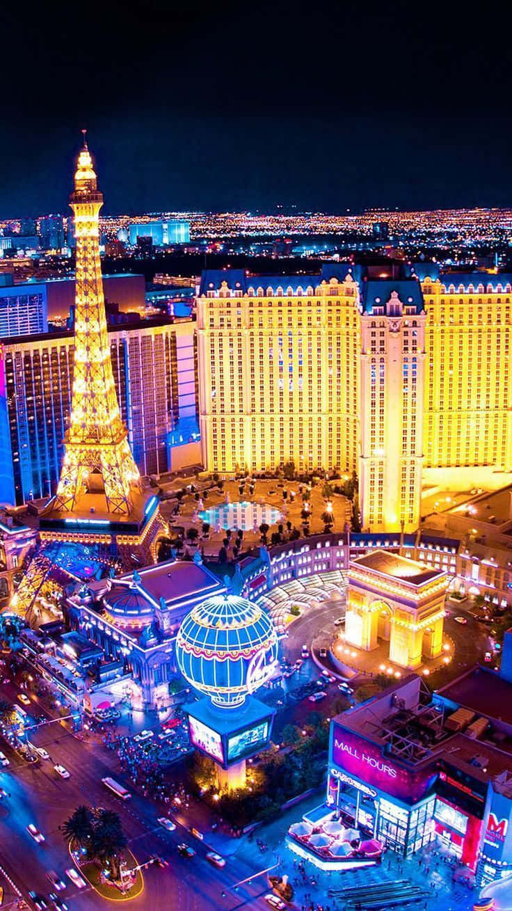 Vibrant Las Vegas Cityscape at Night Through a Mobile Screen Wallpaper