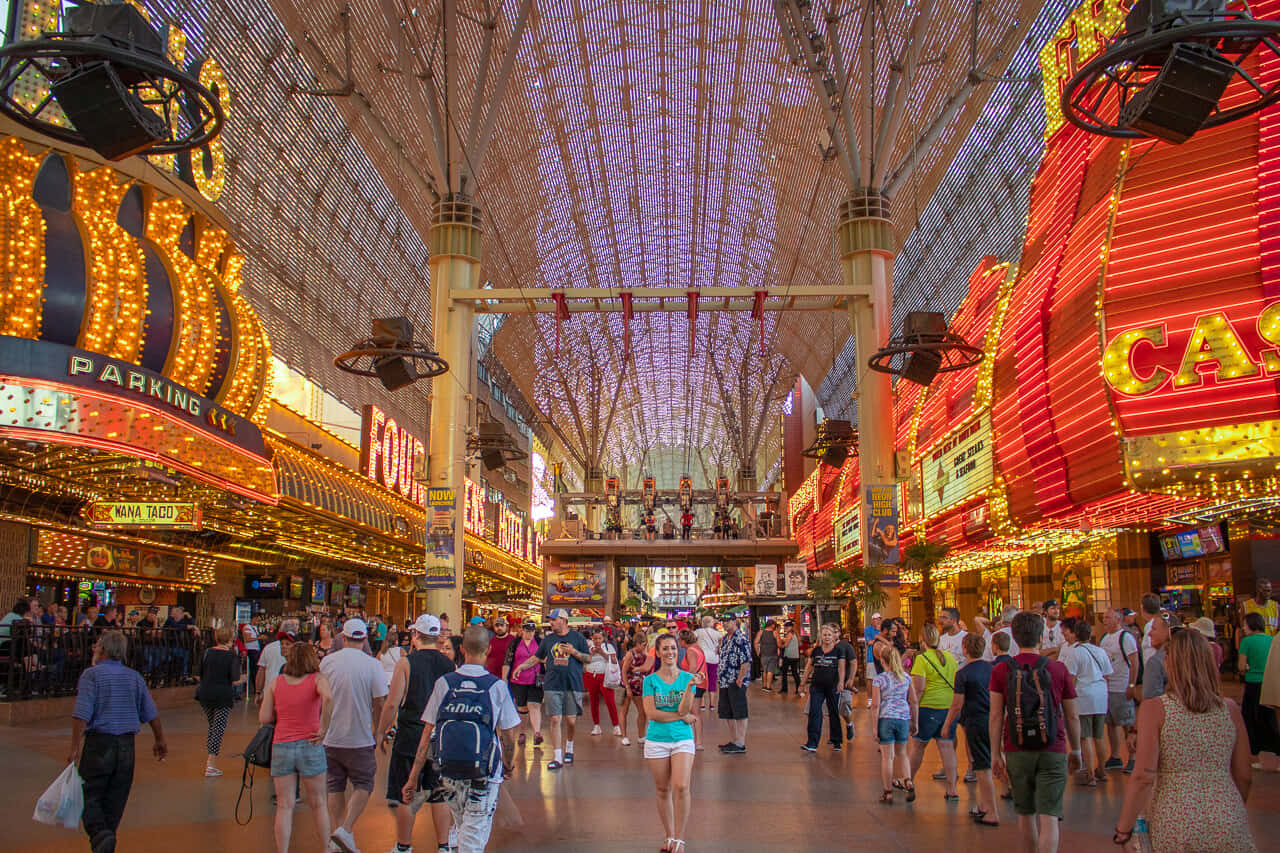 A Large Shopping Mall With Many People Walking Around