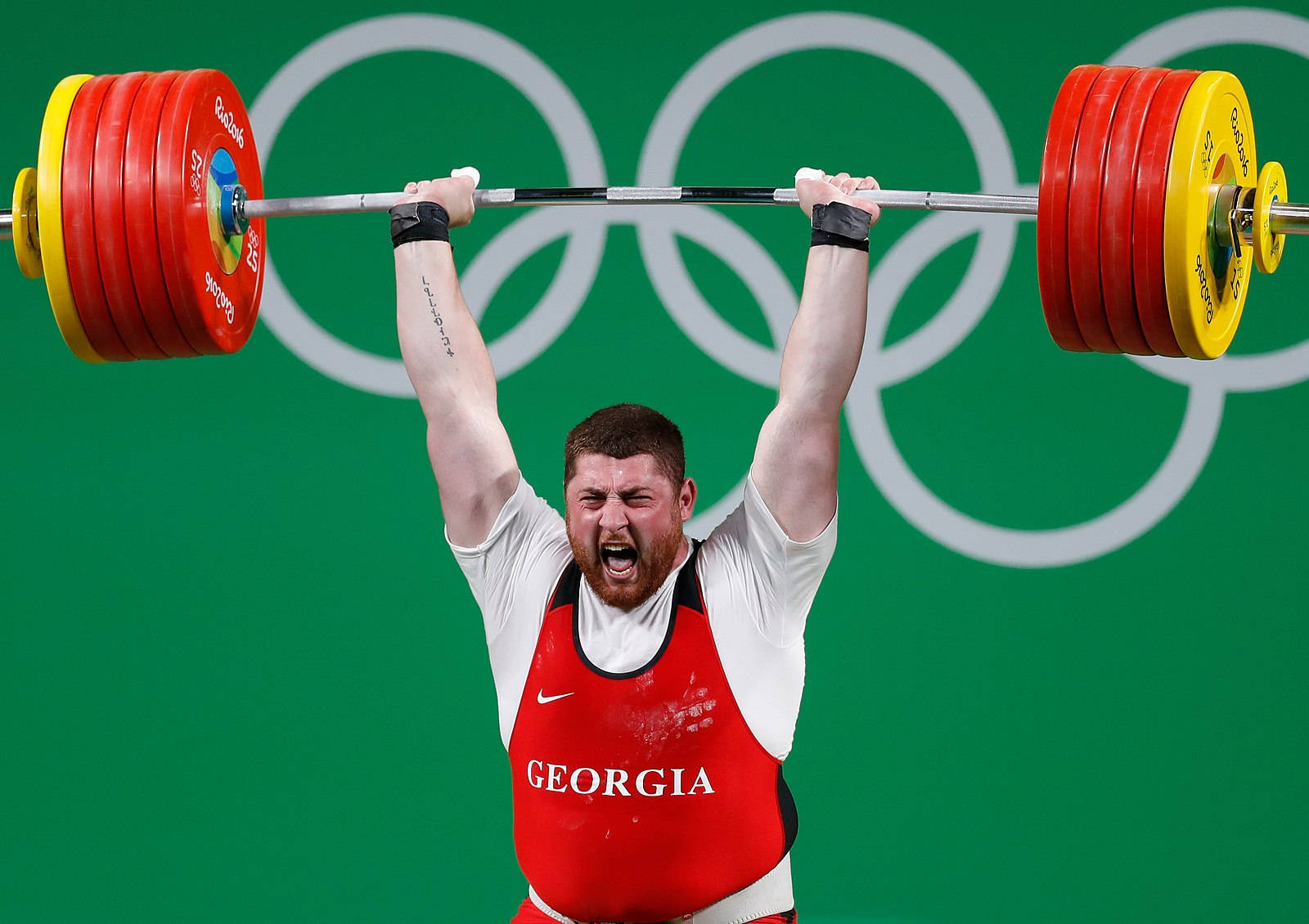 Lasha Talakhadze Weight Lifting At Olympics Wallpaper