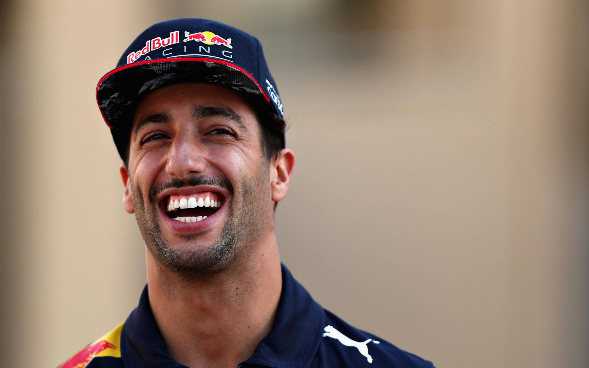 Download Daniel Ricciardo Laughing Expressively Wallpaper | Wallpapers.com