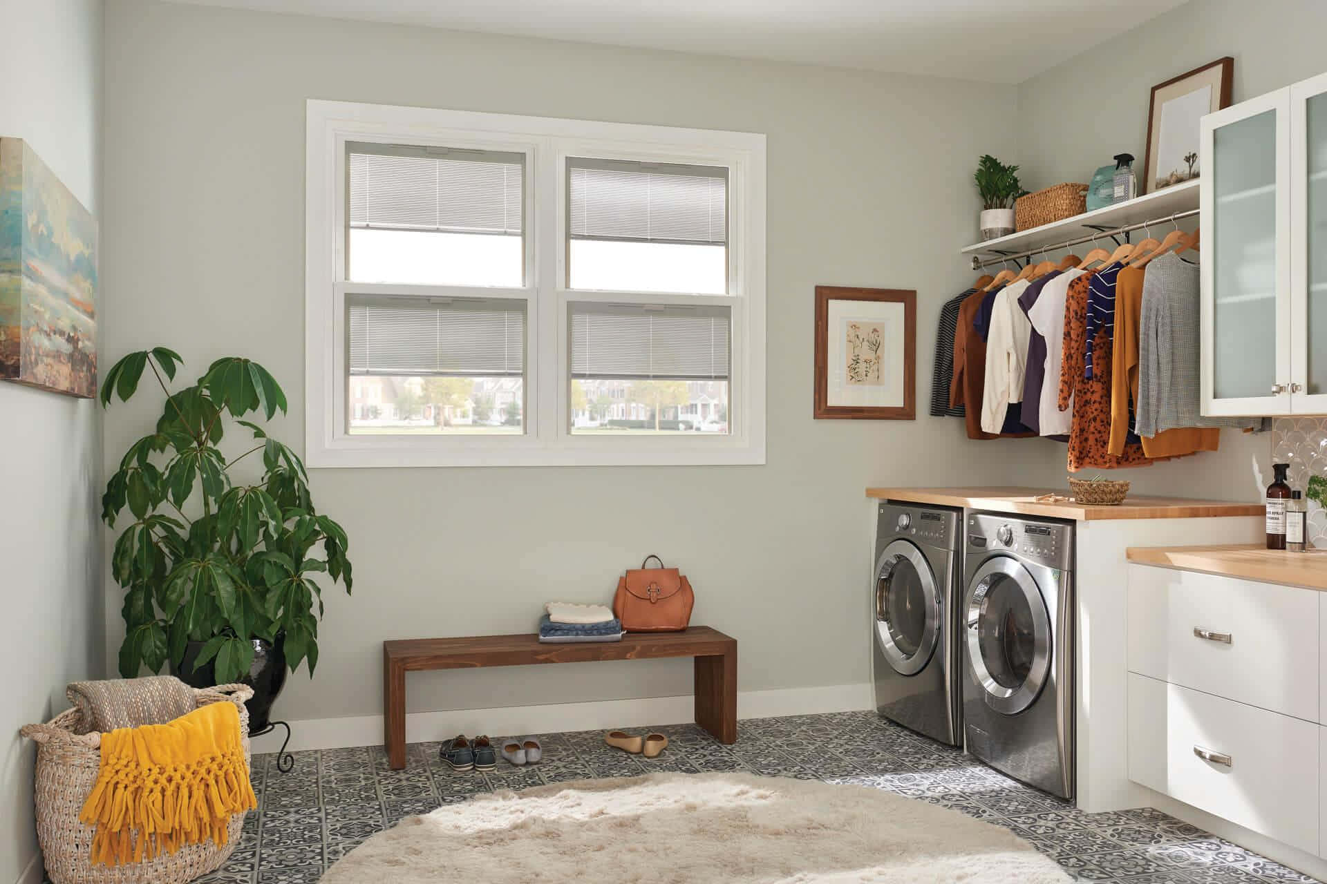 A Laundry Room With A Washer And Dryer