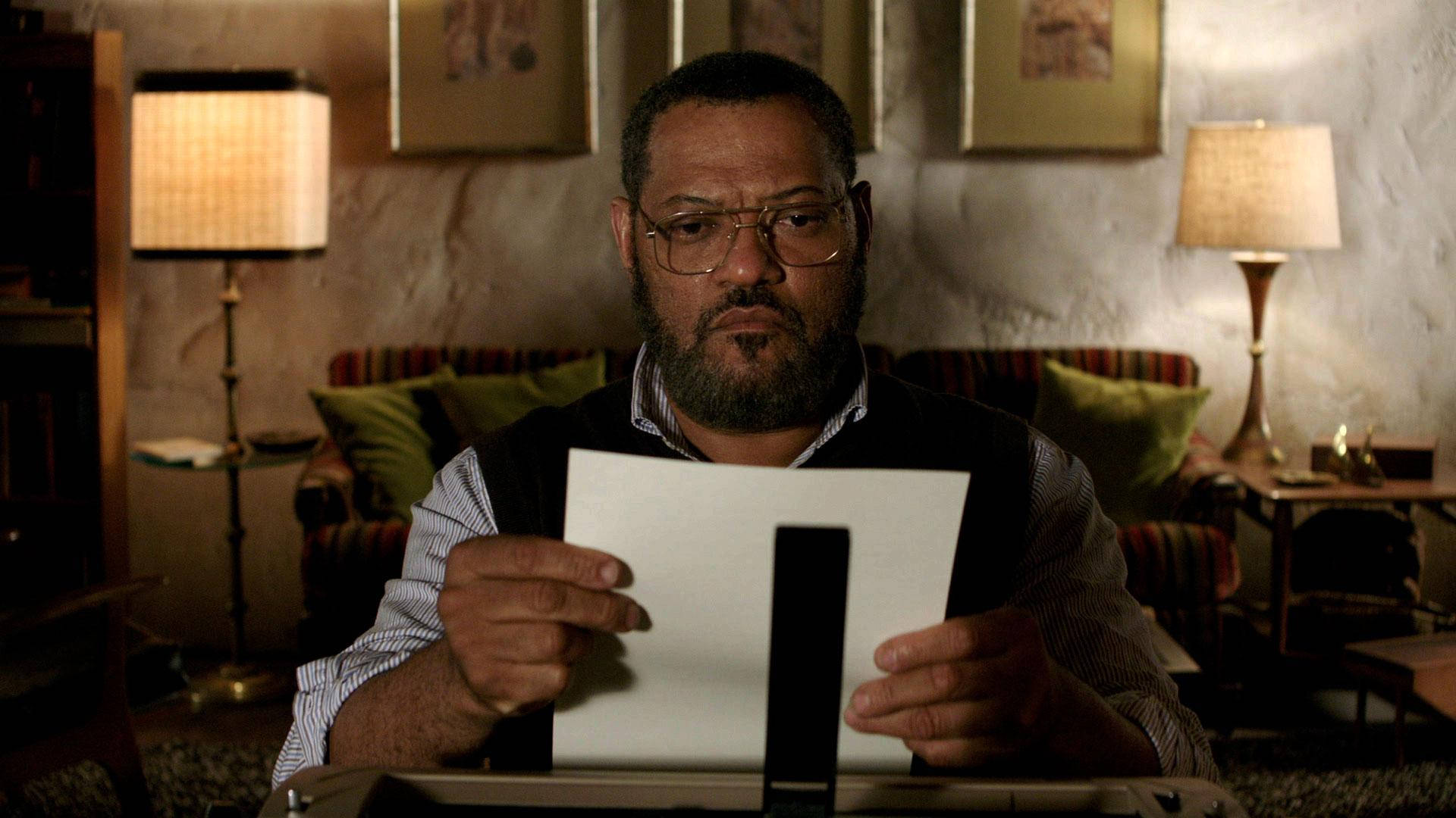 Profound Thespian Laurence Fishburne Deep in Thought While Reading Wallpaper