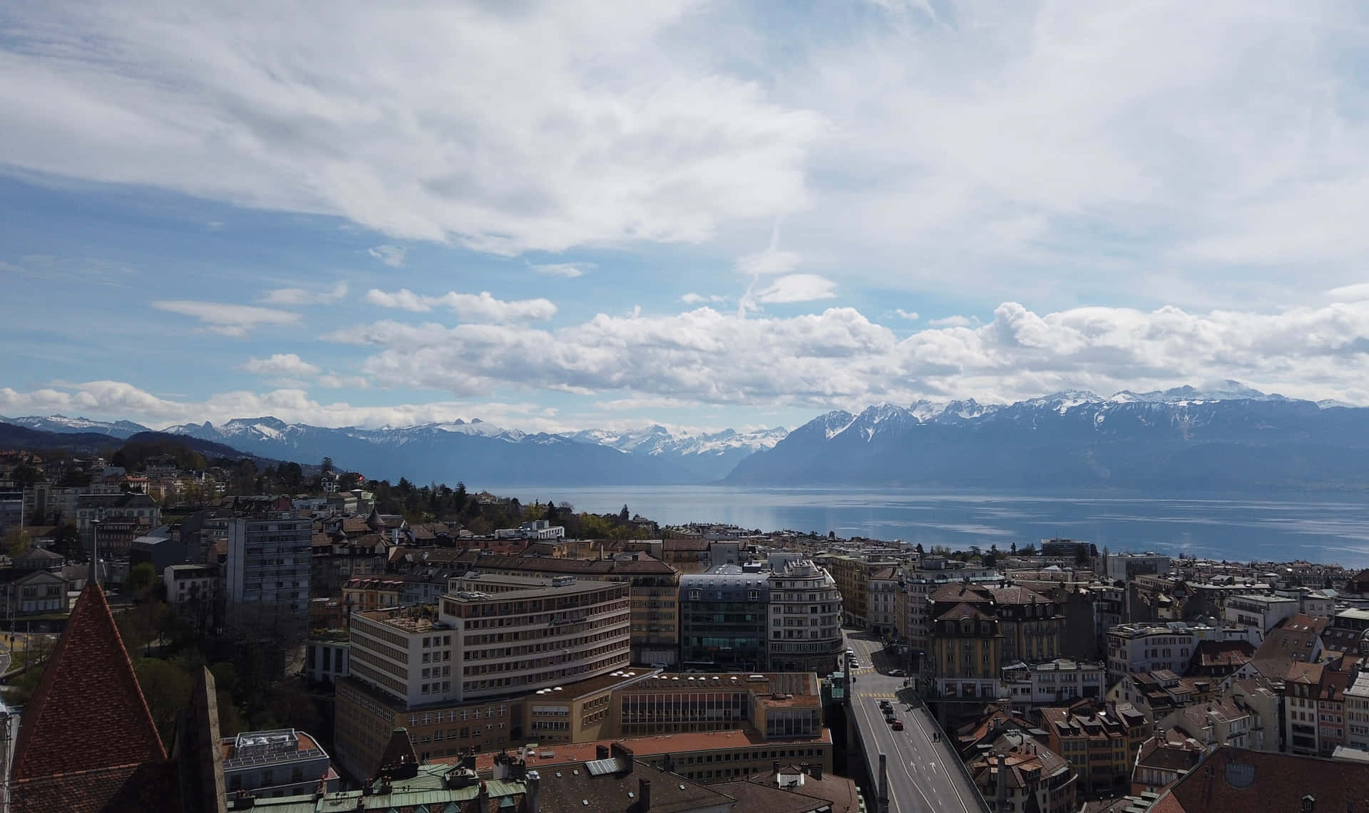 Lausanne Cityscapewith Lake Genevaand Alps Wallpaper