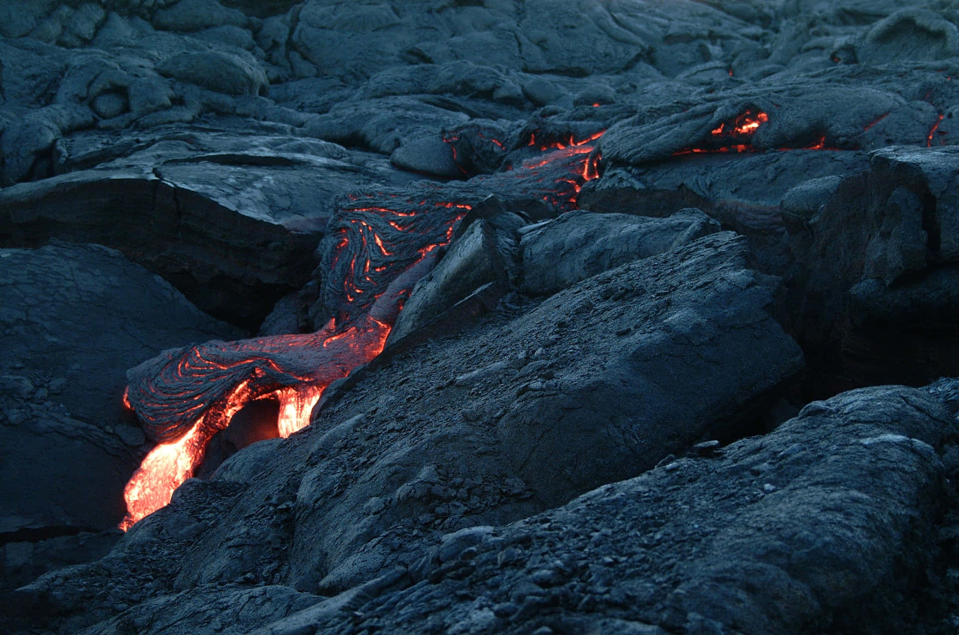 Lava Flowing Down A Rocky Slope
