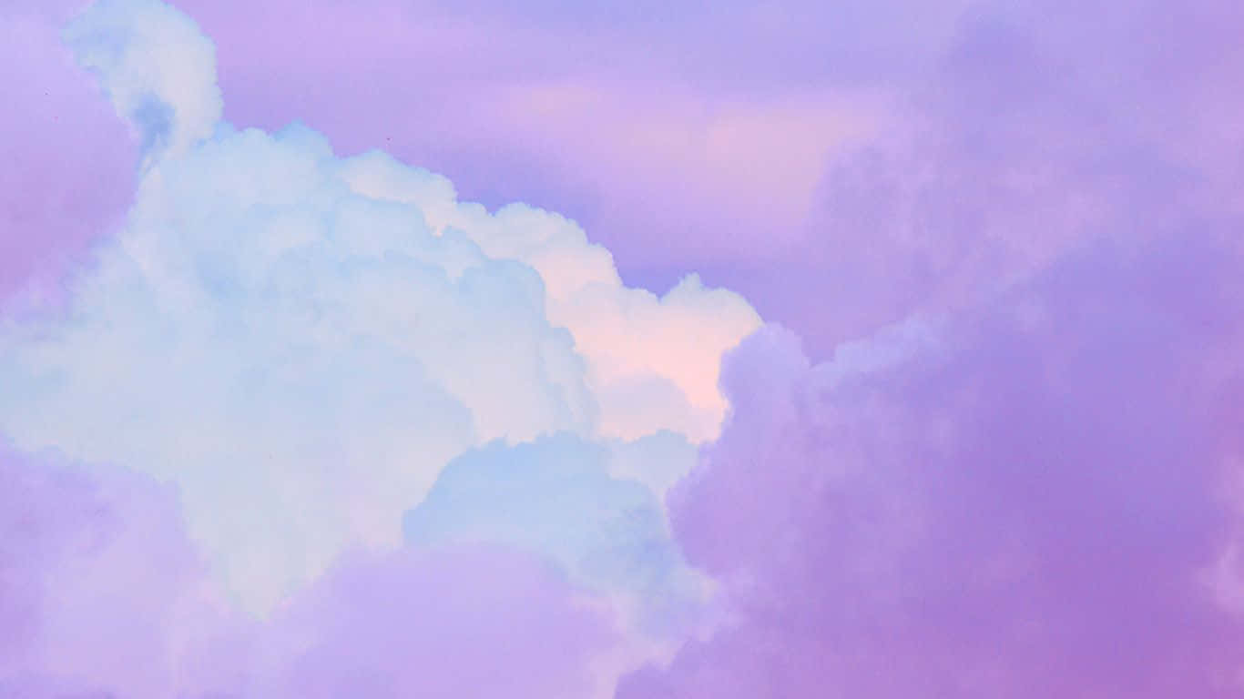 A Pink And Purple Cloudy Sky With A Rainbow Wallpaper